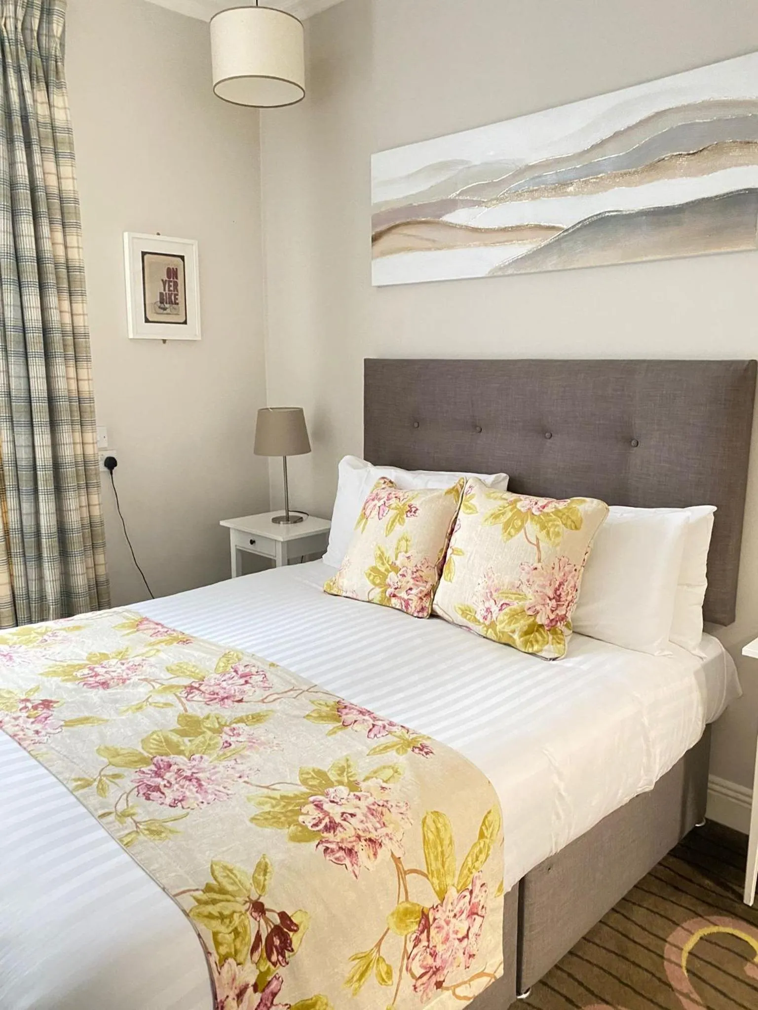 Bed in Tom Dick and Harriet's Accommodation