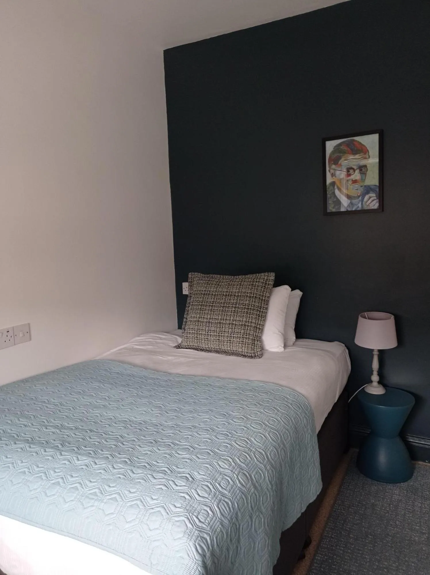 Bed in Tom Dick and Harriet's Accommodation