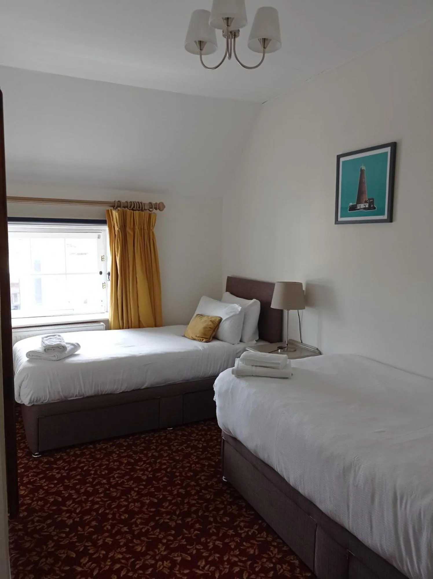 Bed in Tom Dick and Harriet's Accommodation