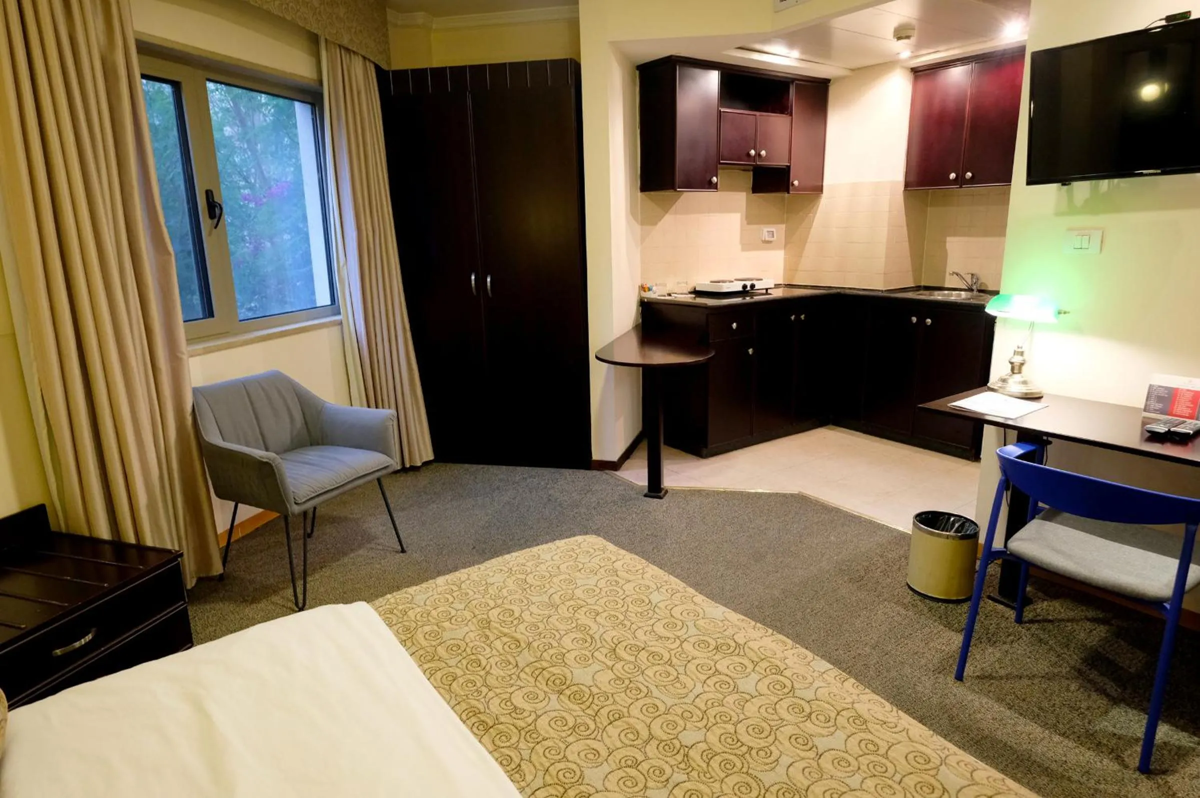 Bed in Royal Court Hotel