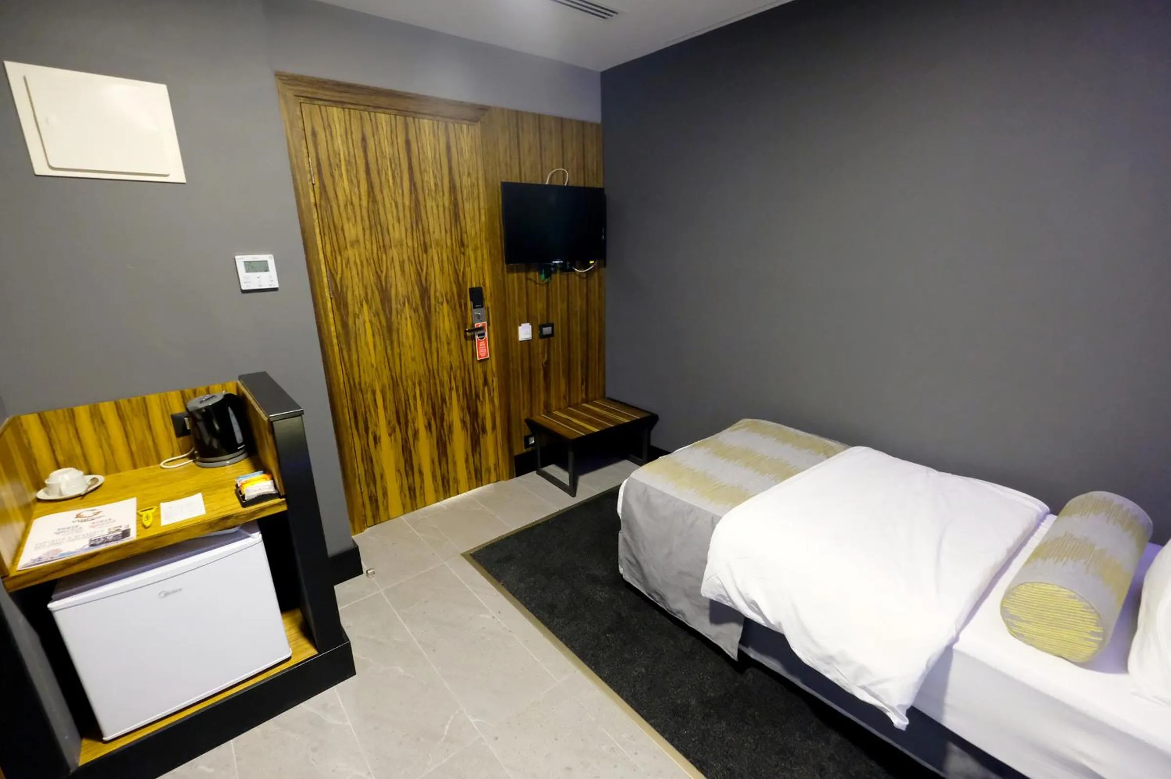 Bed in Royal Court Hotel