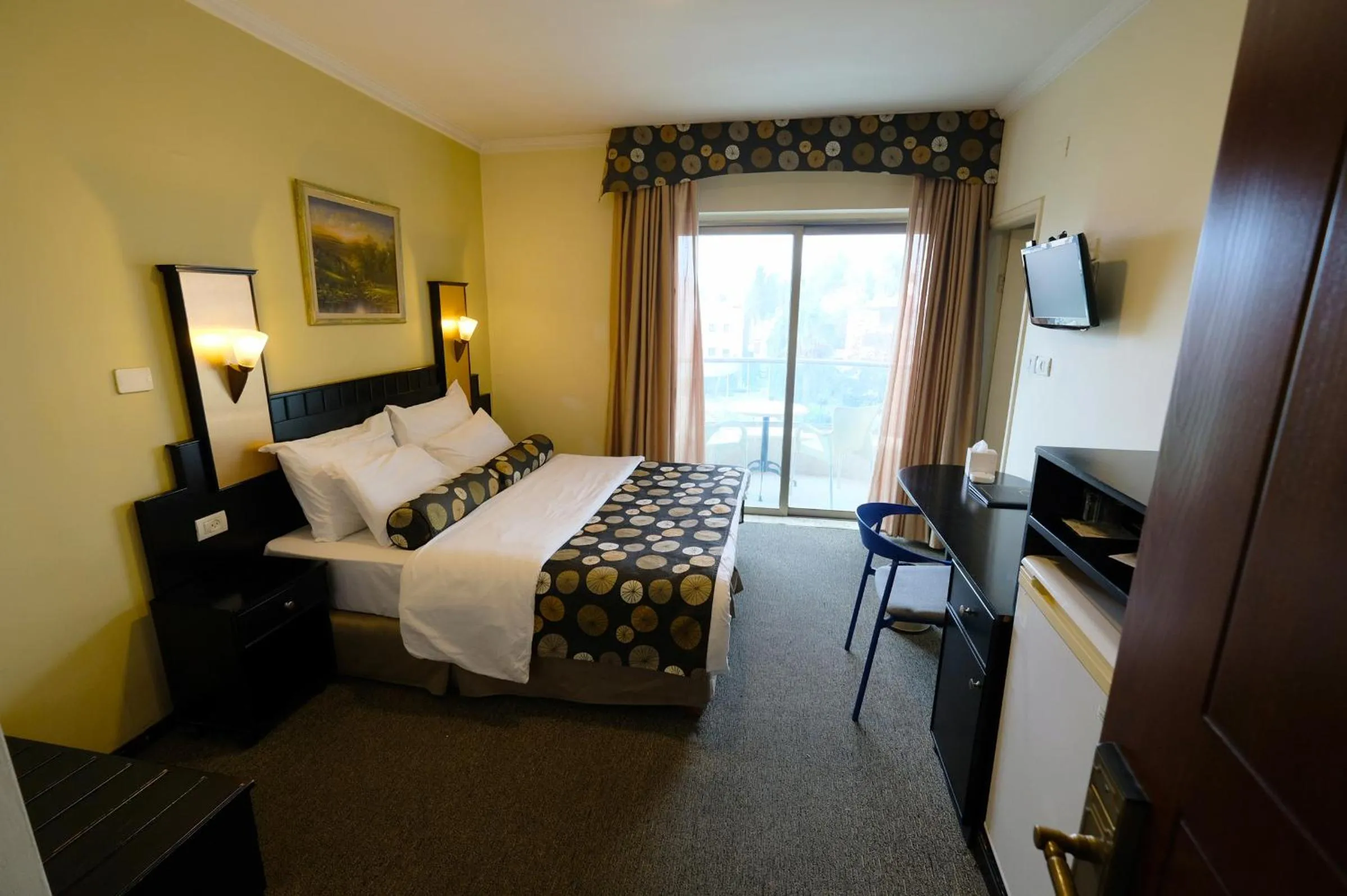 Bed in Royal Court Hotel