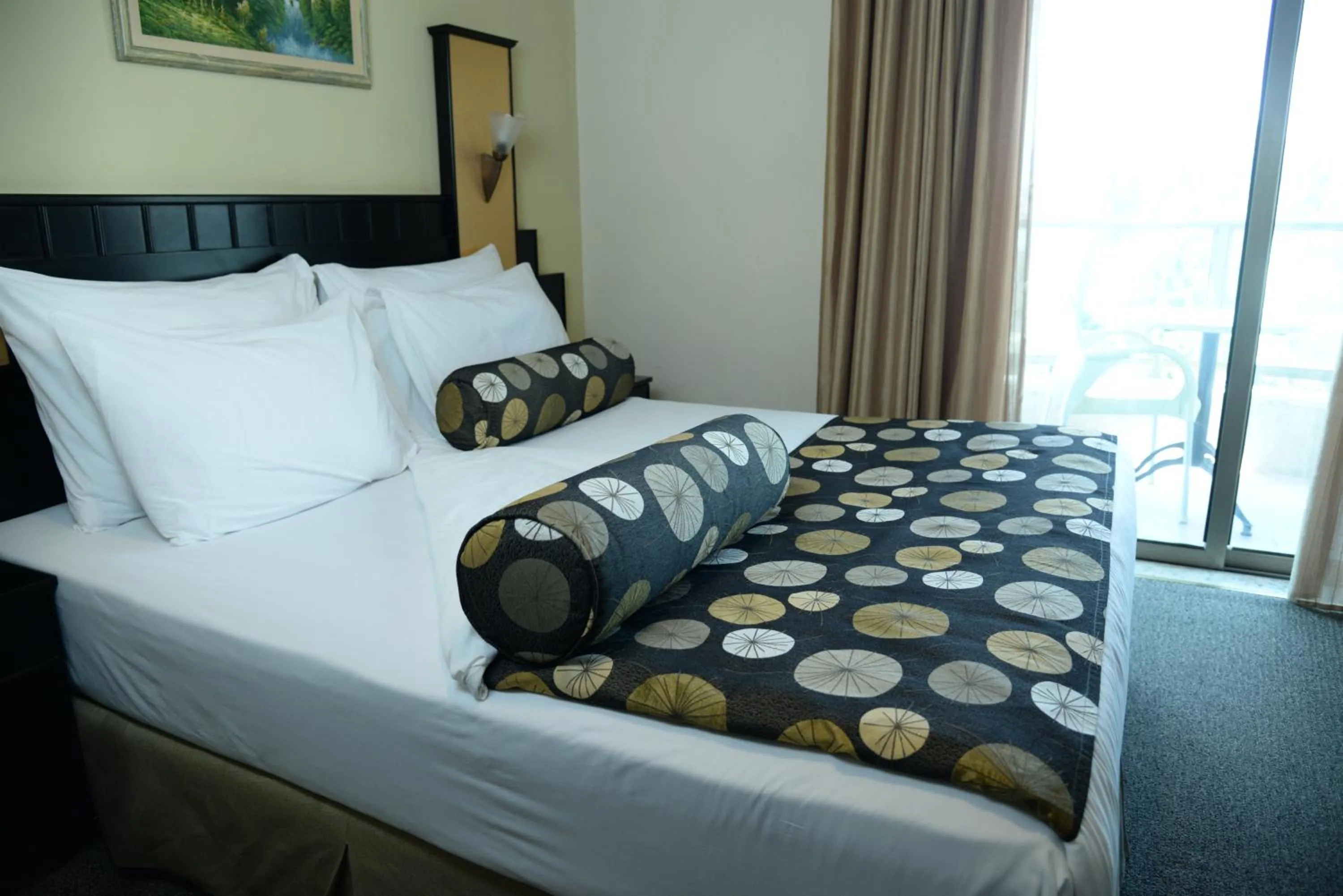 Bed in Royal Court Hotel