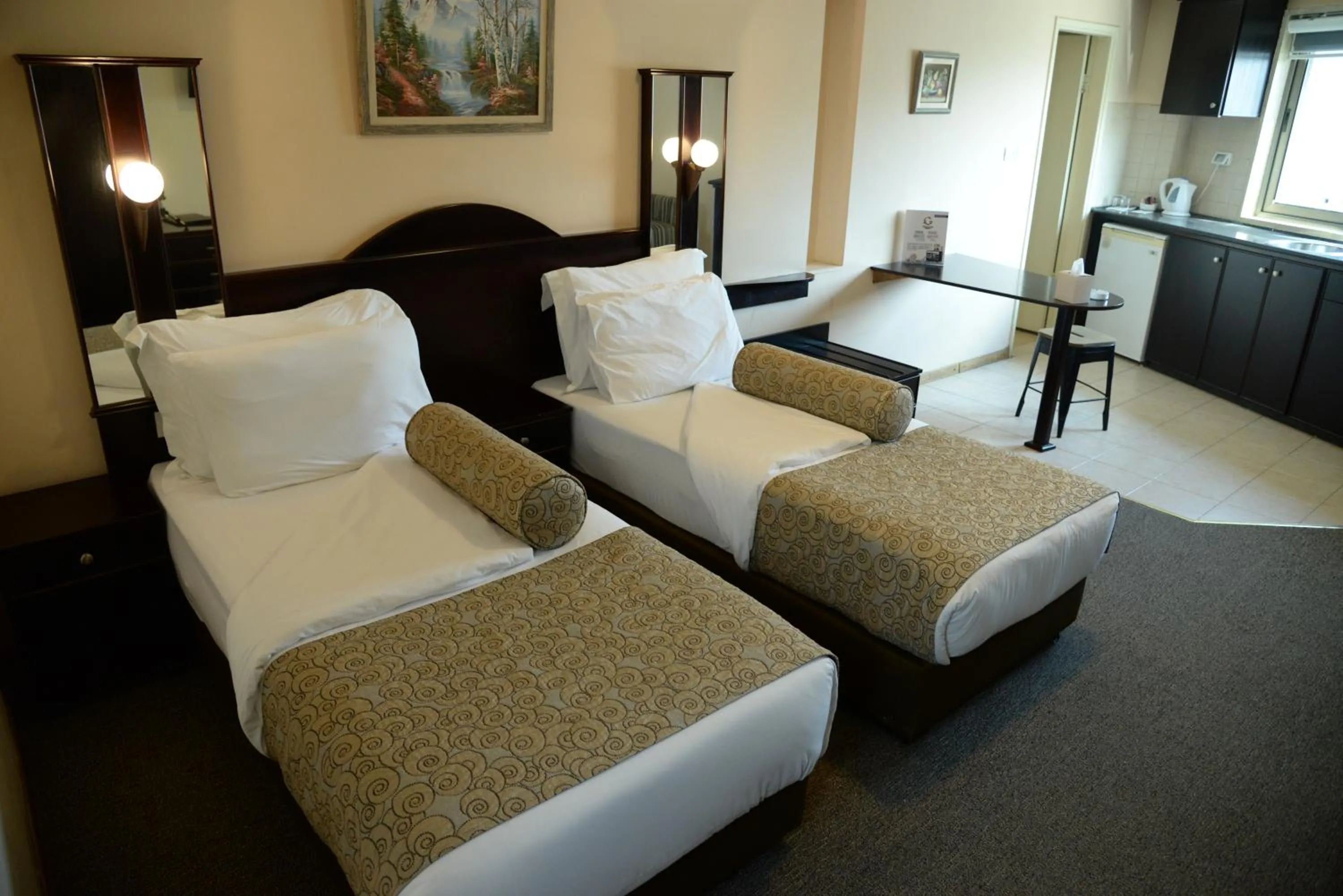 Bed in Royal Court Hotel
