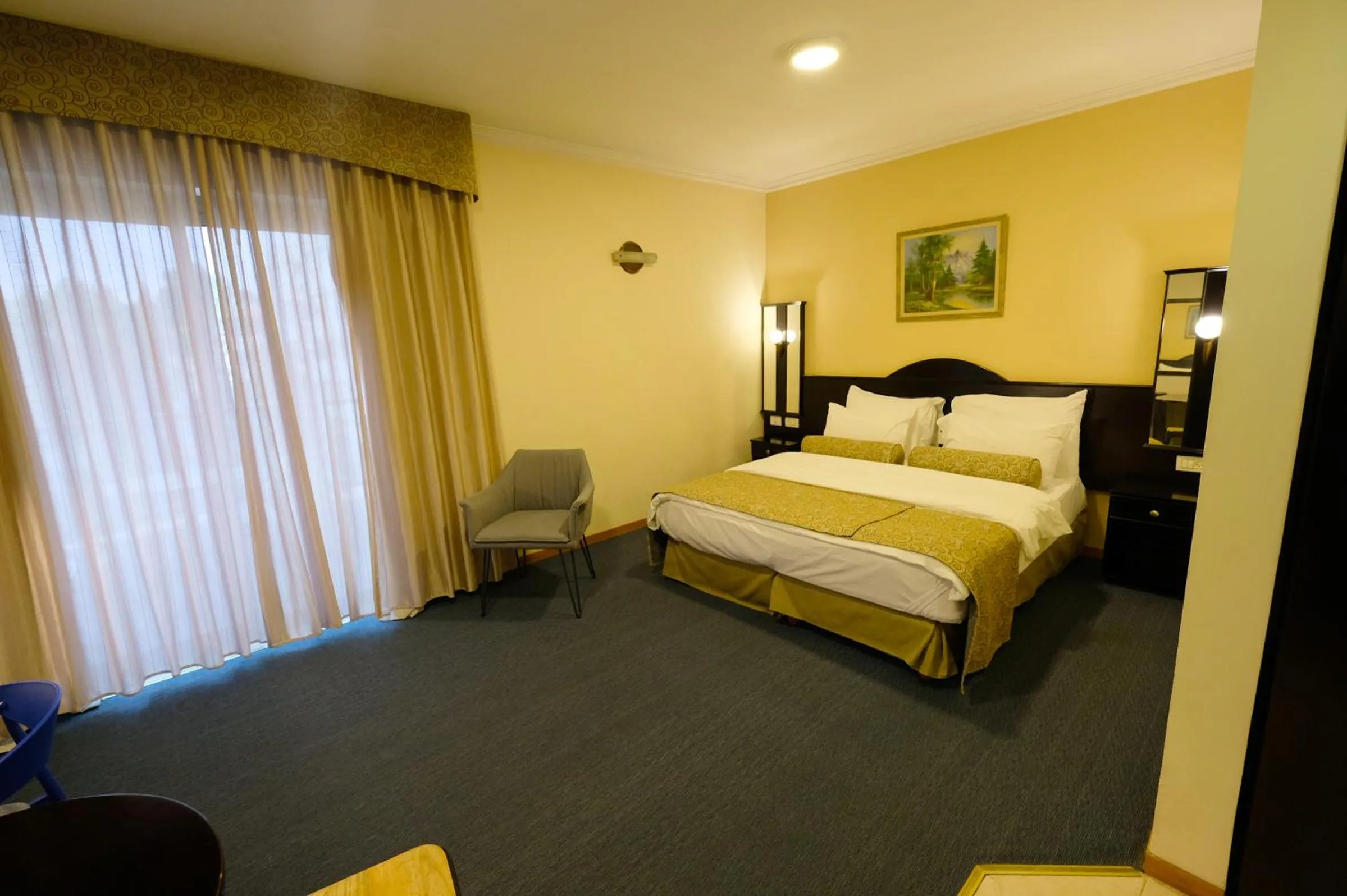 Bed in Royal Court Hotel