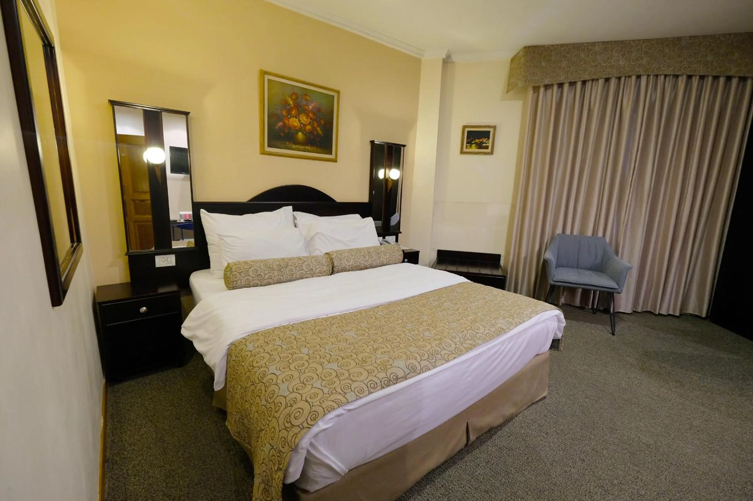 Bed in Royal Court Hotel