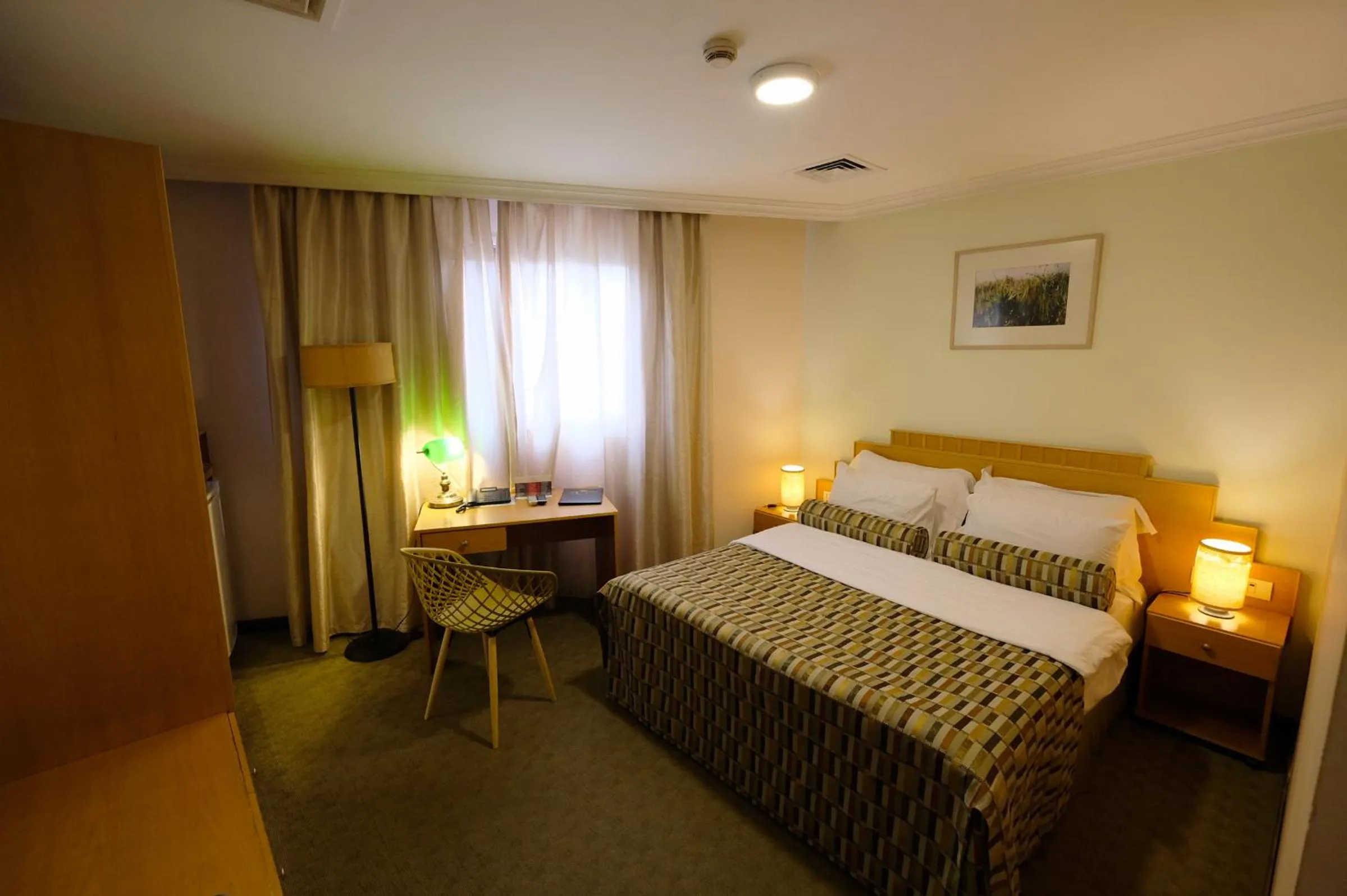 Bed in Royal Court Hotel