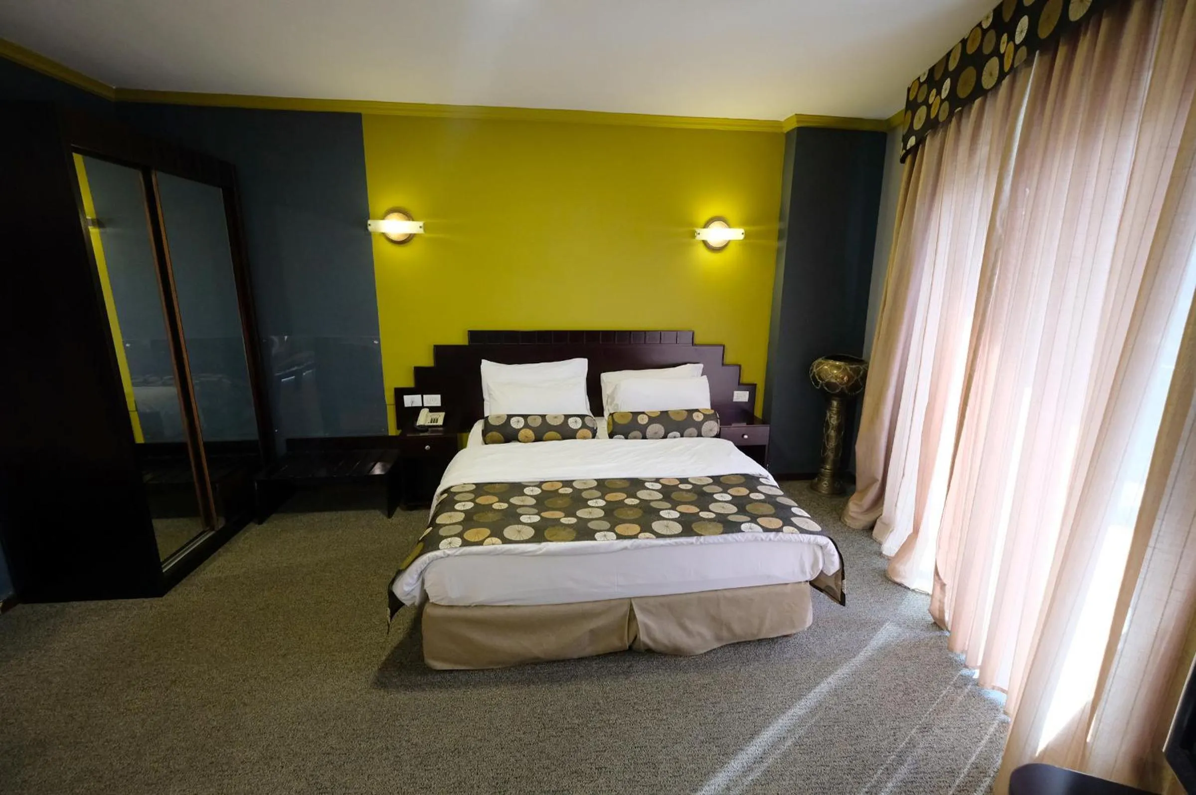 Bed in Royal Court Hotel