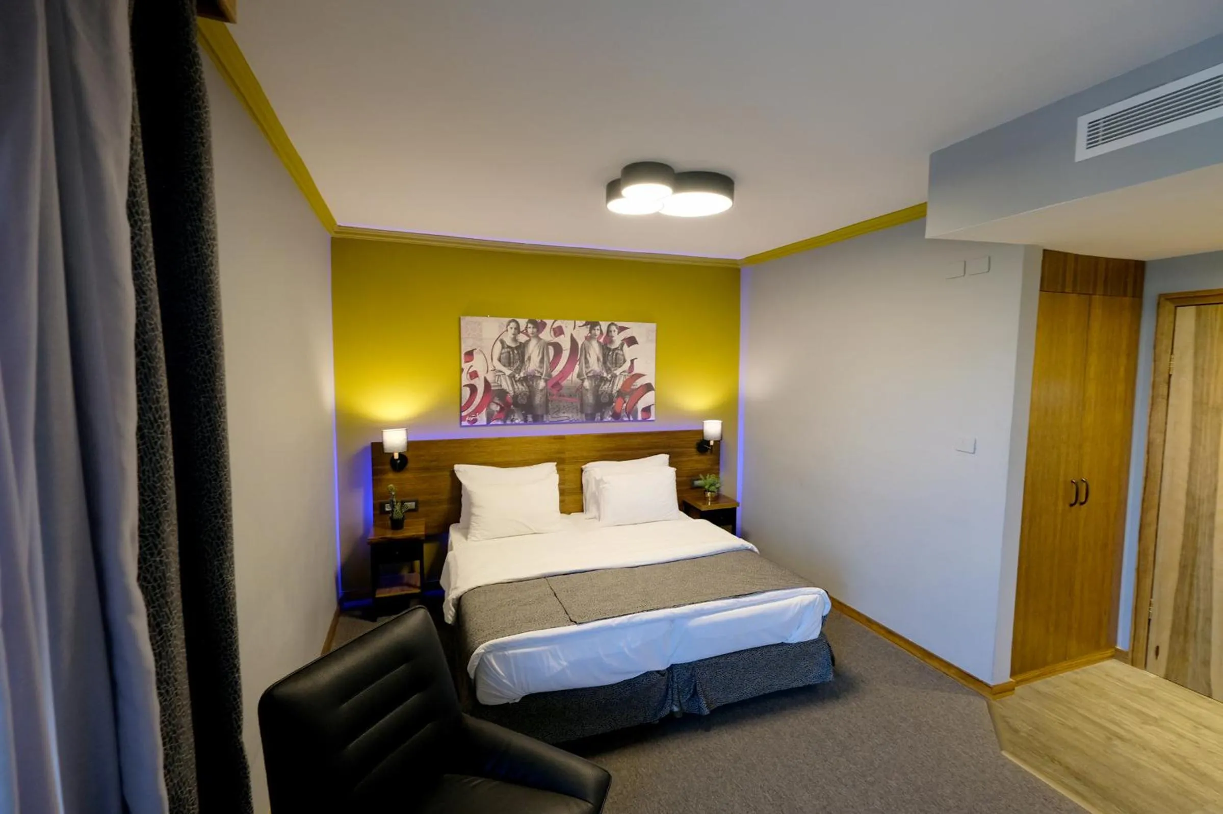 Bed in Royal Court Hotel