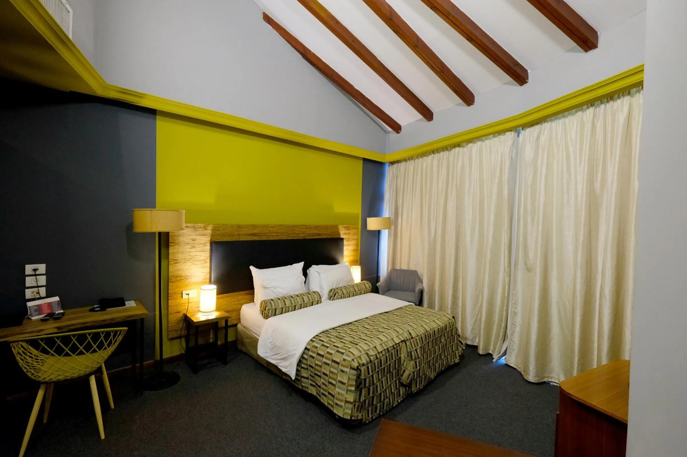 Bed in Royal Court Hotel