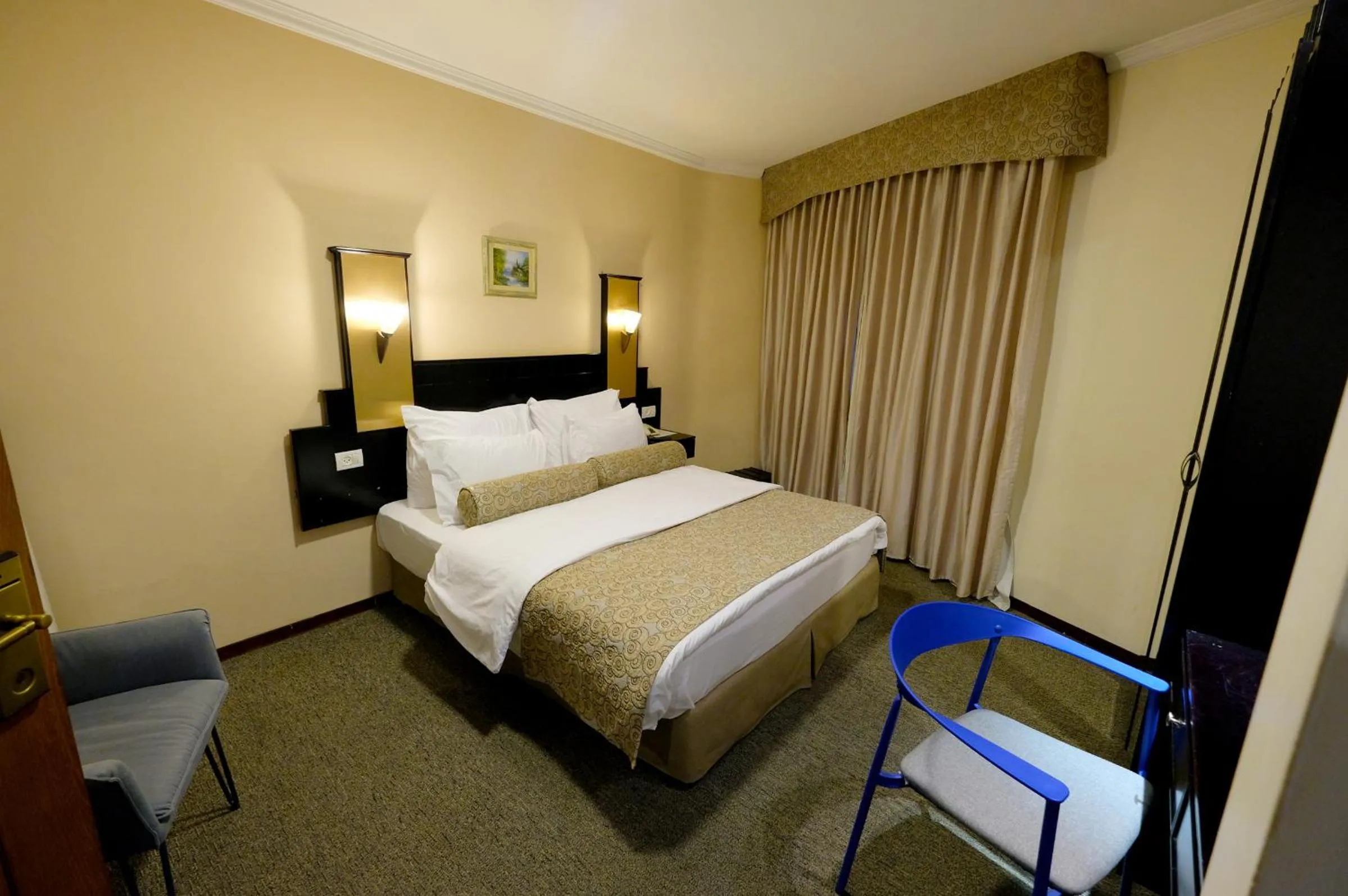 Bed in Royal Court Hotel
