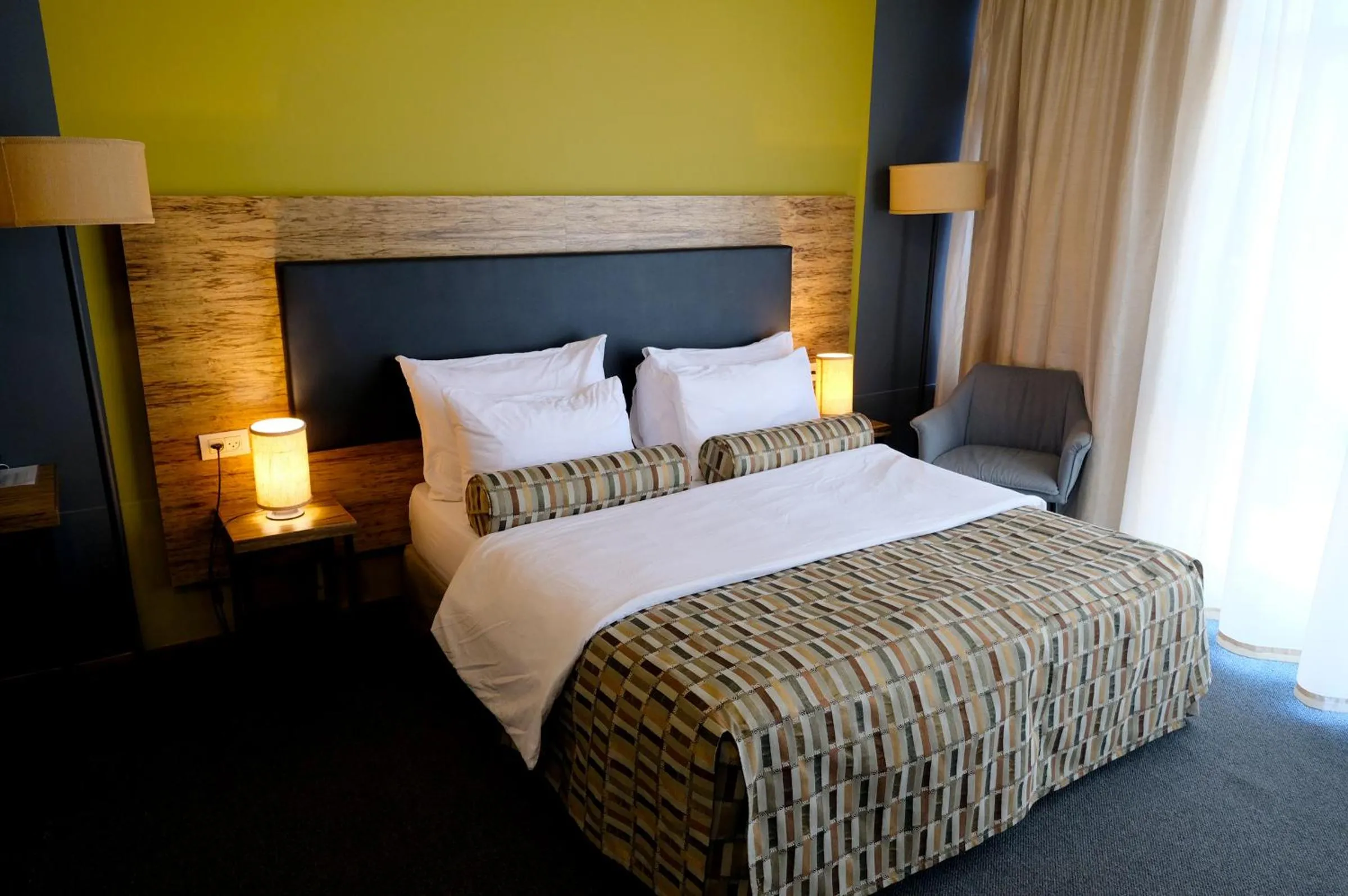 Bed in Royal Court Hotel