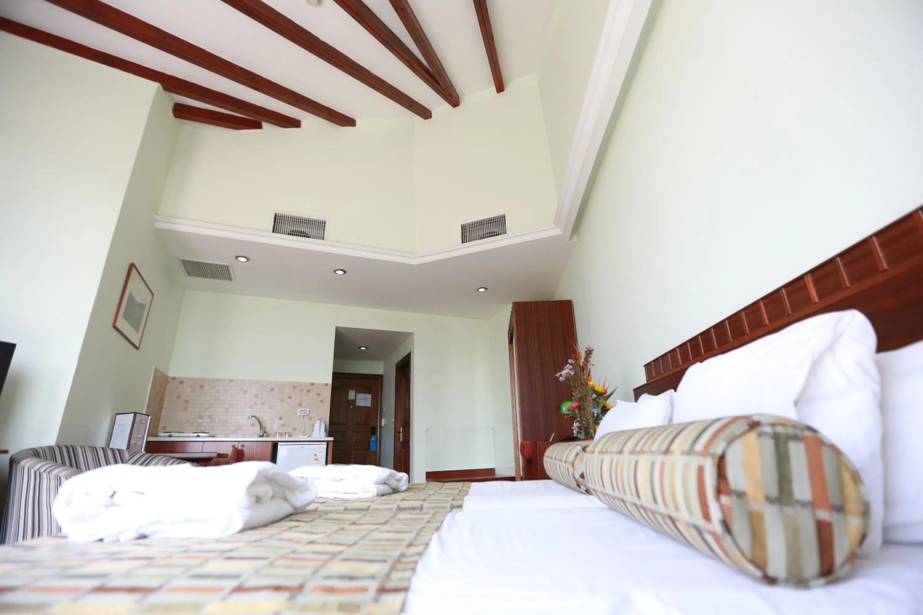 Bed in Royal Court Hotel
