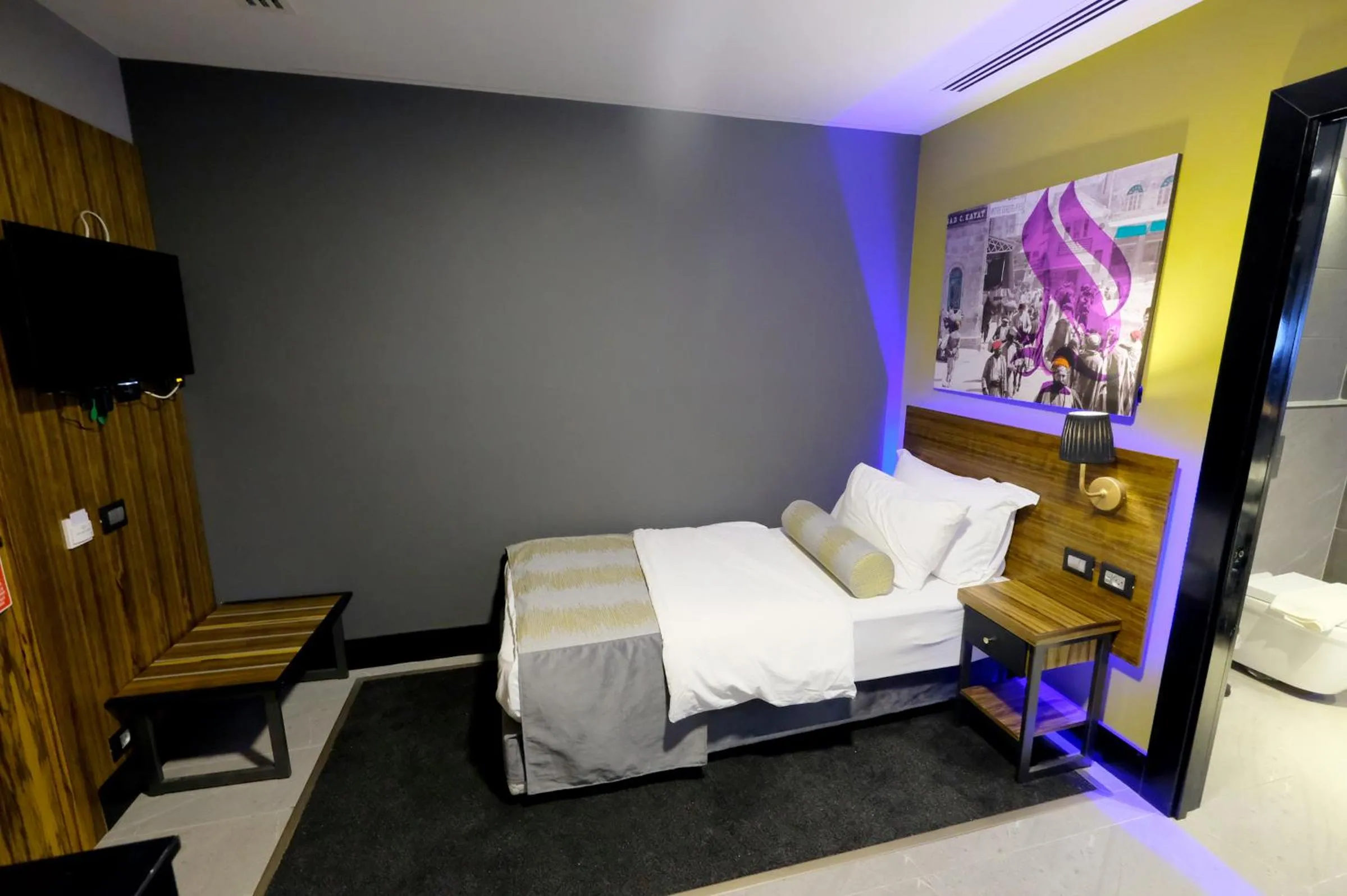 Bed in Royal Court Hotel