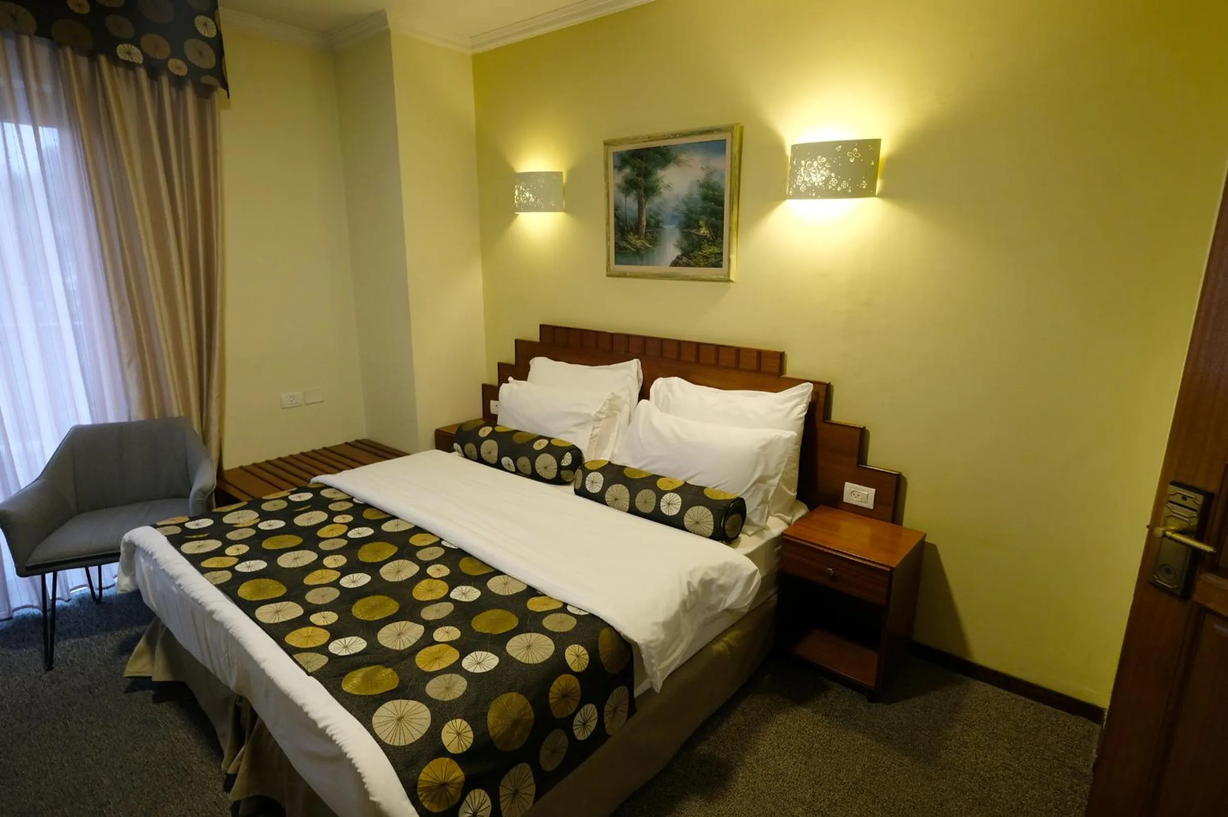 Bed in Royal Court Hotel