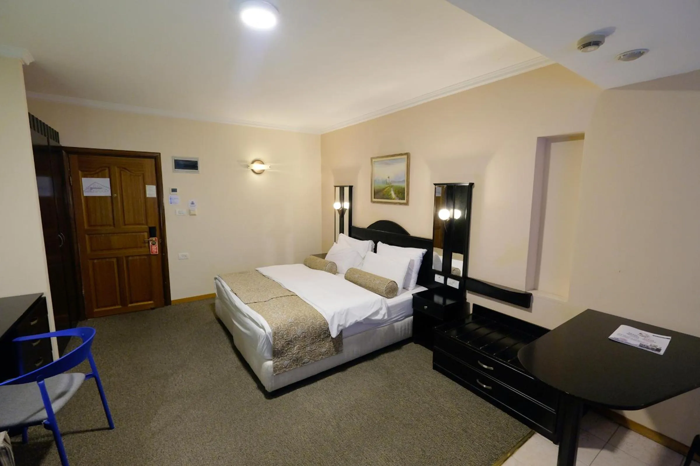 Bed in Royal Court Hotel