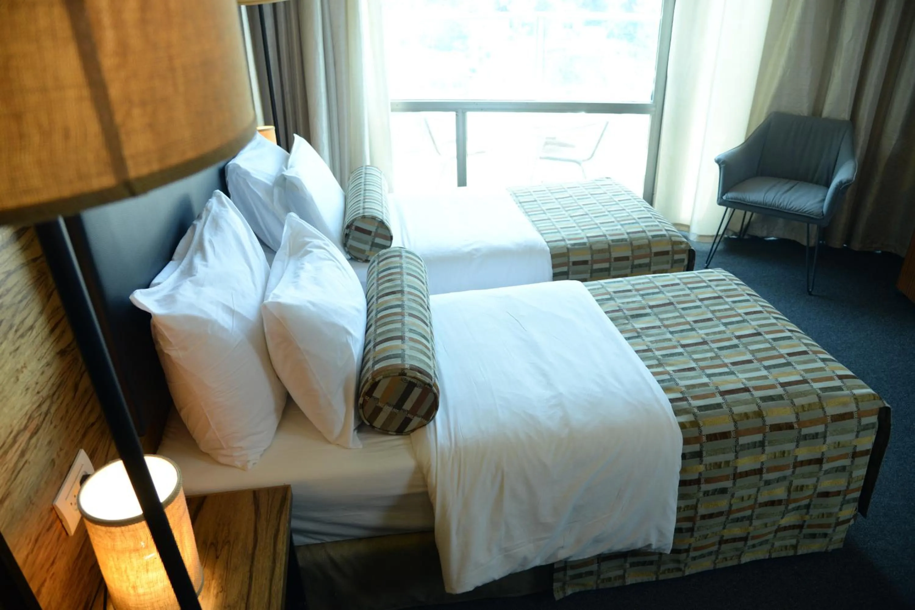 Bed in Royal Court Hotel