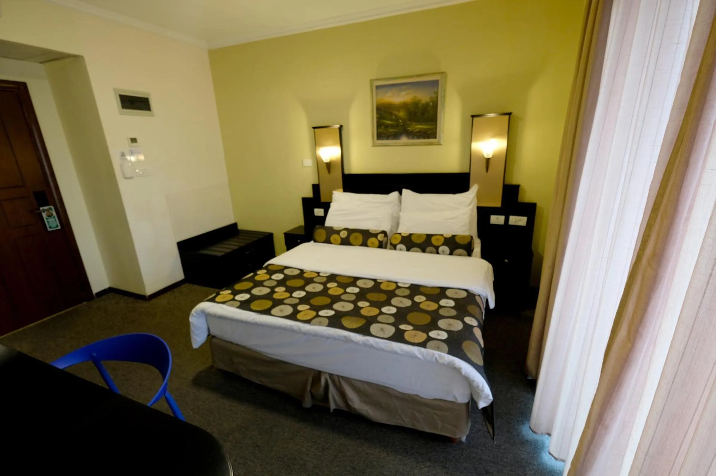 Bed in Royal Court Hotel