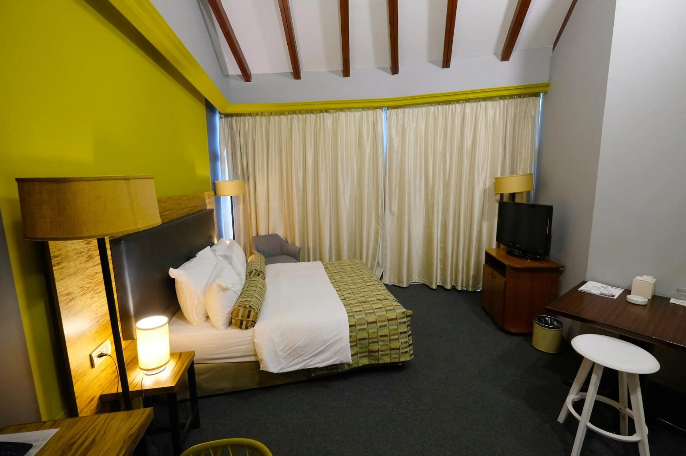 Bed in Royal Court Hotel