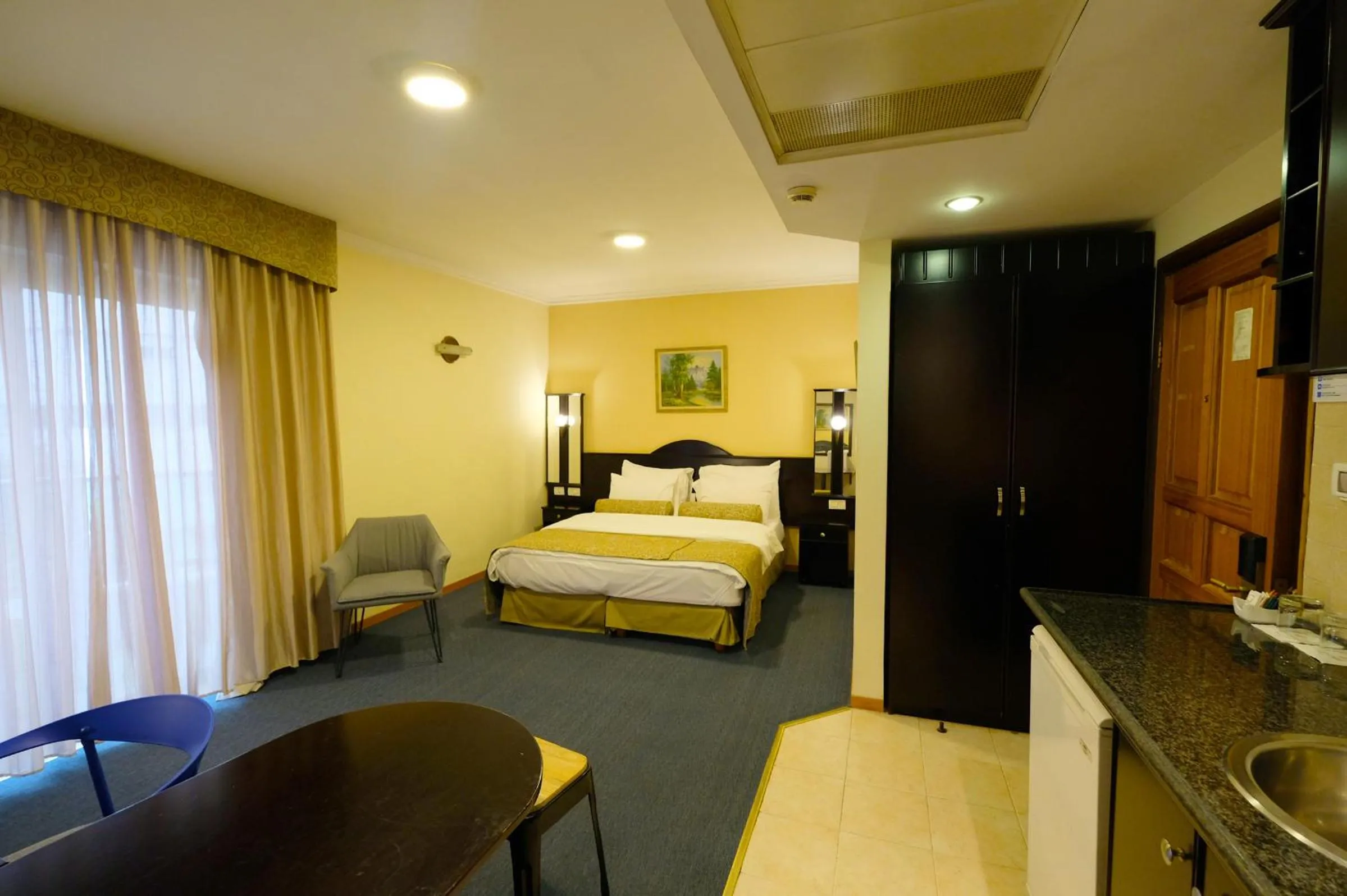 Bed in Royal Court Hotel