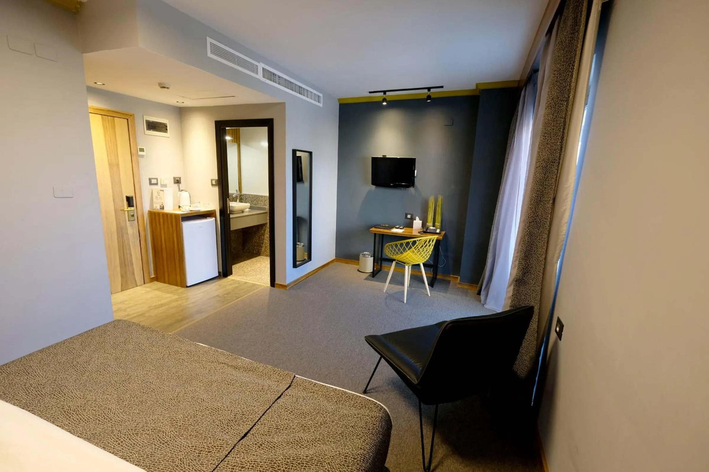 Bed in Royal Court Hotel
