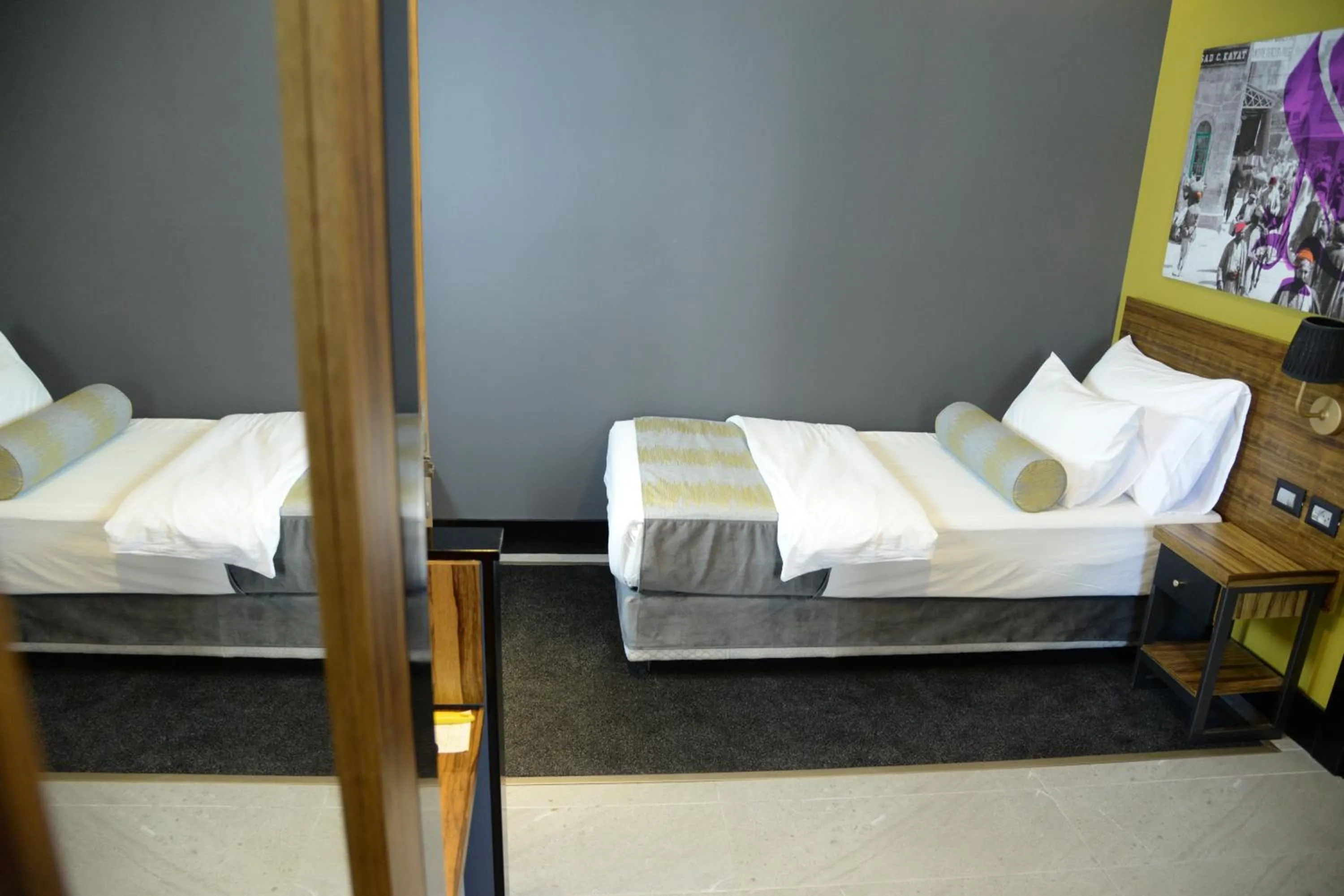 Bed in Royal Court Hotel