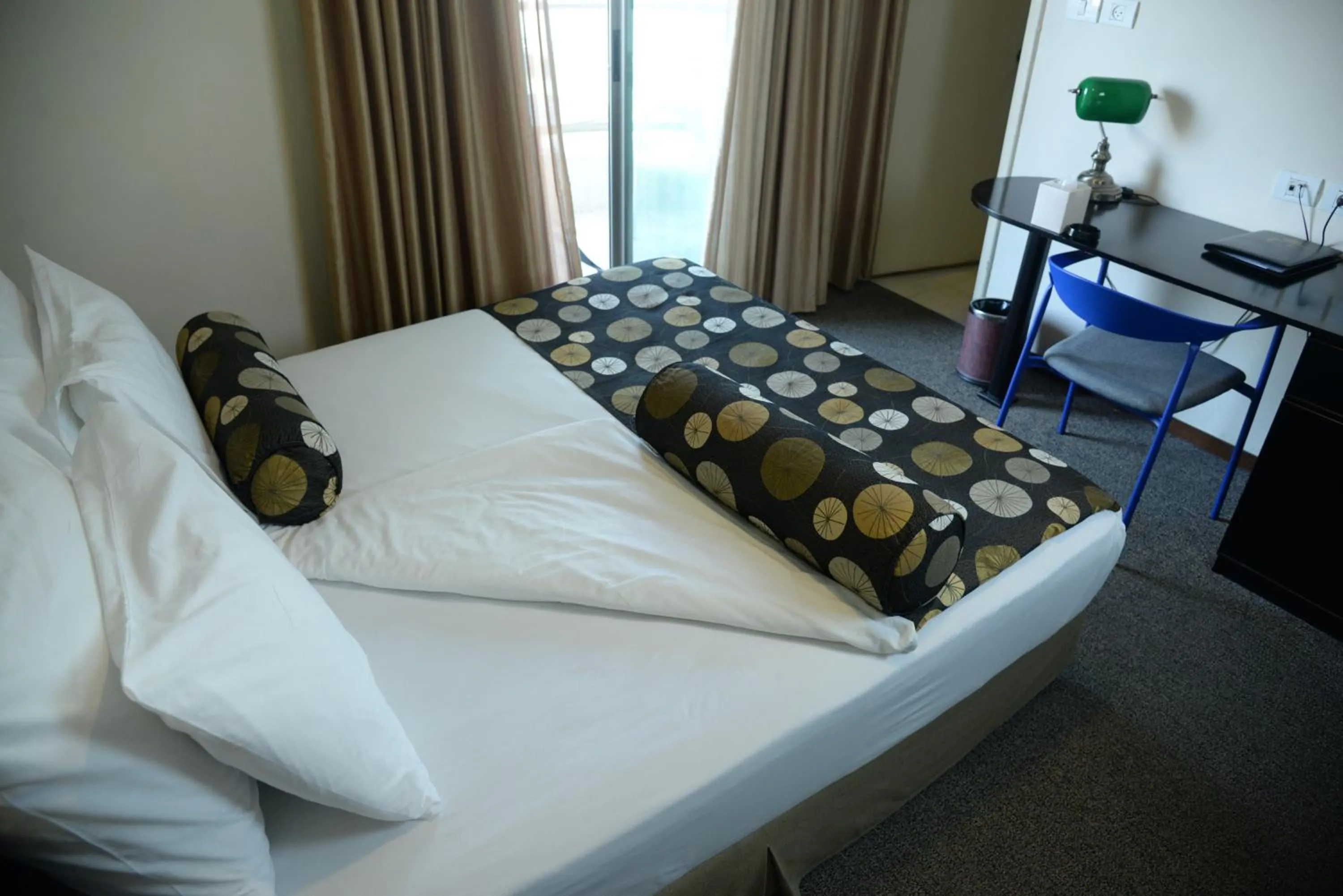 Bed in Royal Court Hotel
