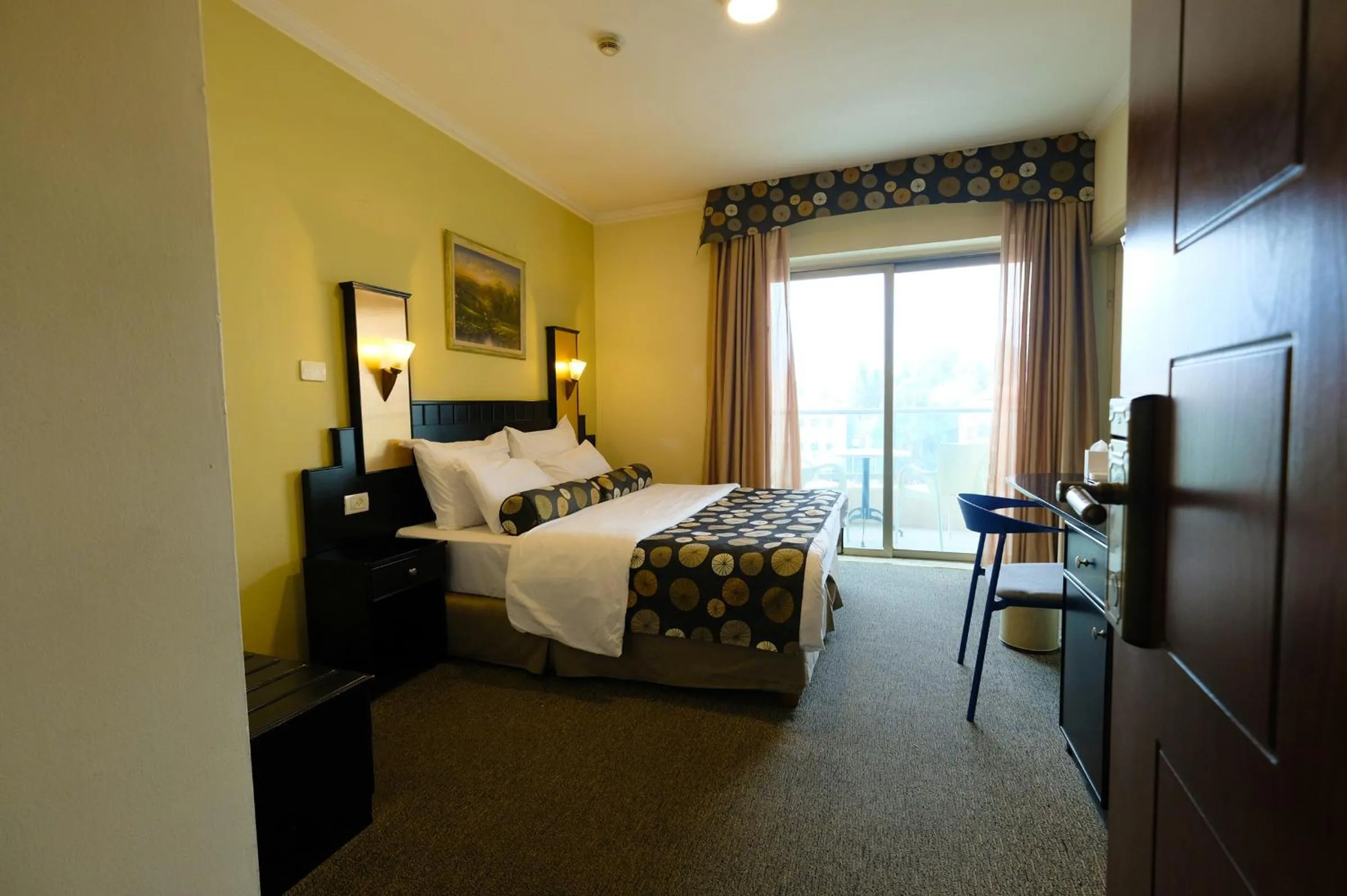Bed in Royal Court Hotel