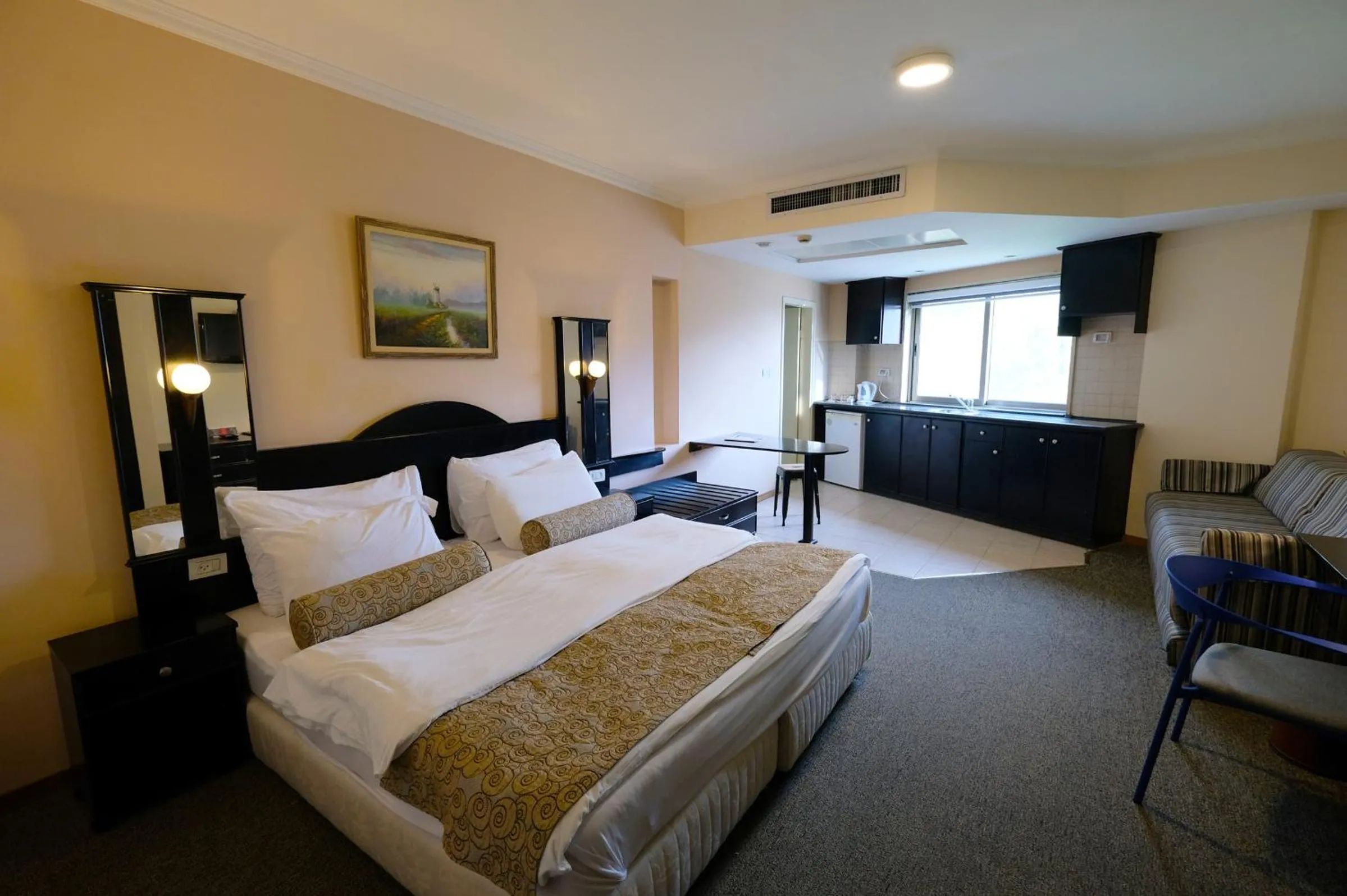 Bed in Royal Court Hotel