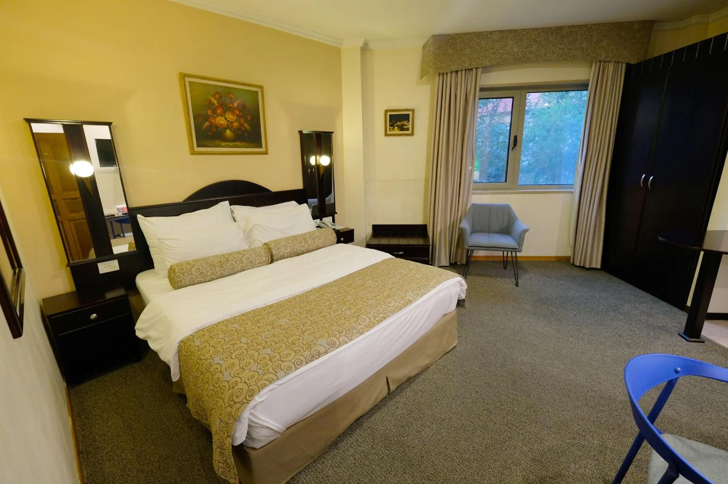 Bed in Royal Court Hotel