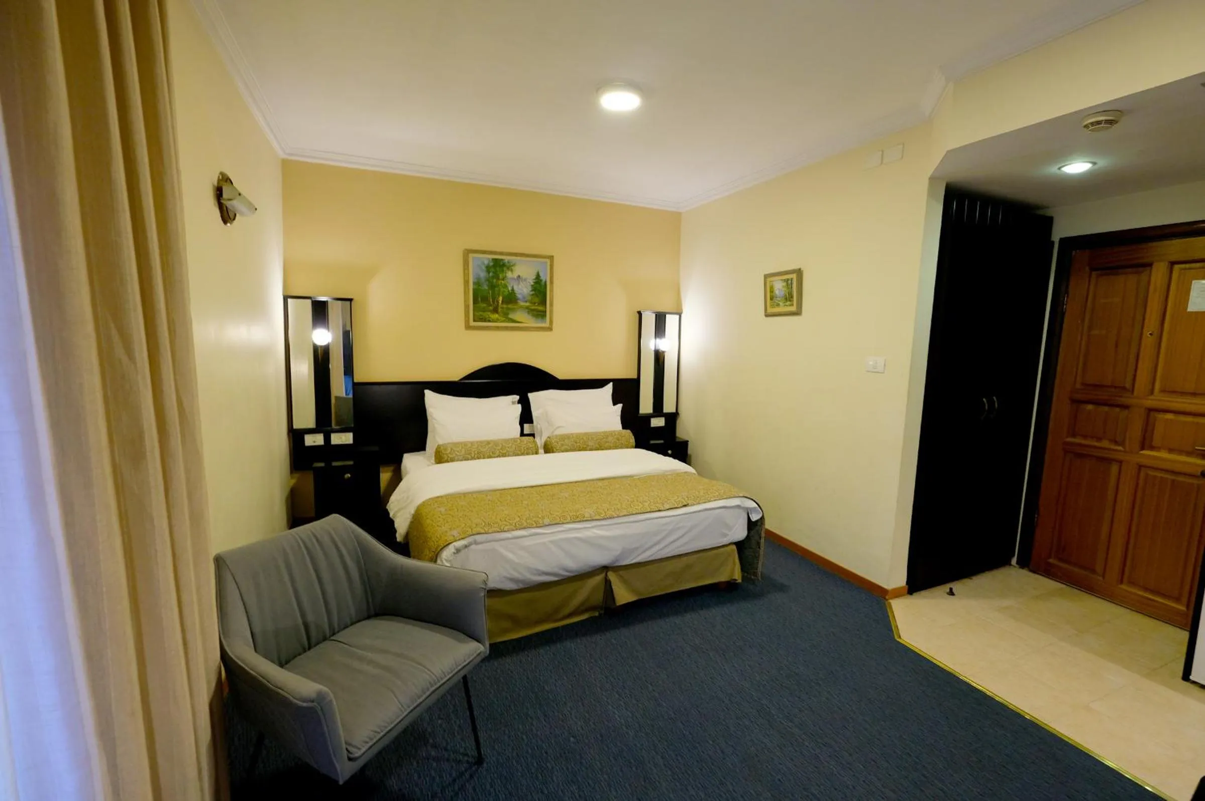 Bed in Royal Court Hotel