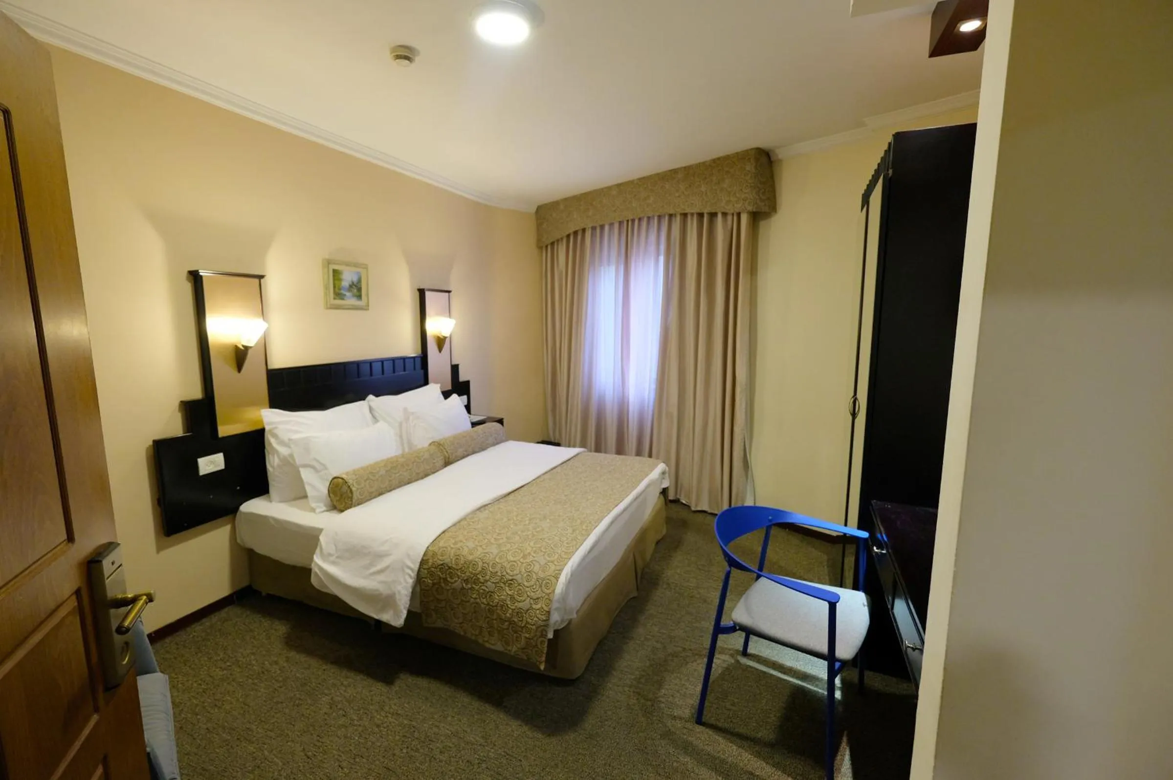 Bed in Royal Court Hotel