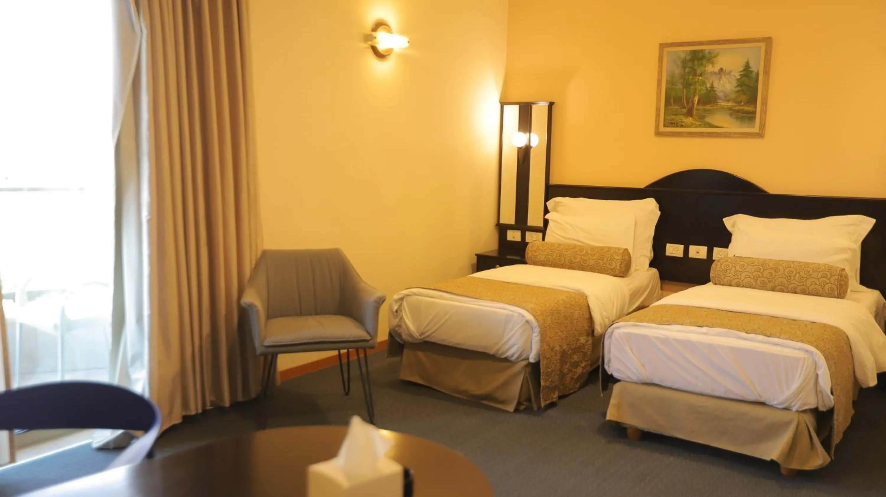 Bed in Royal Court Hotel