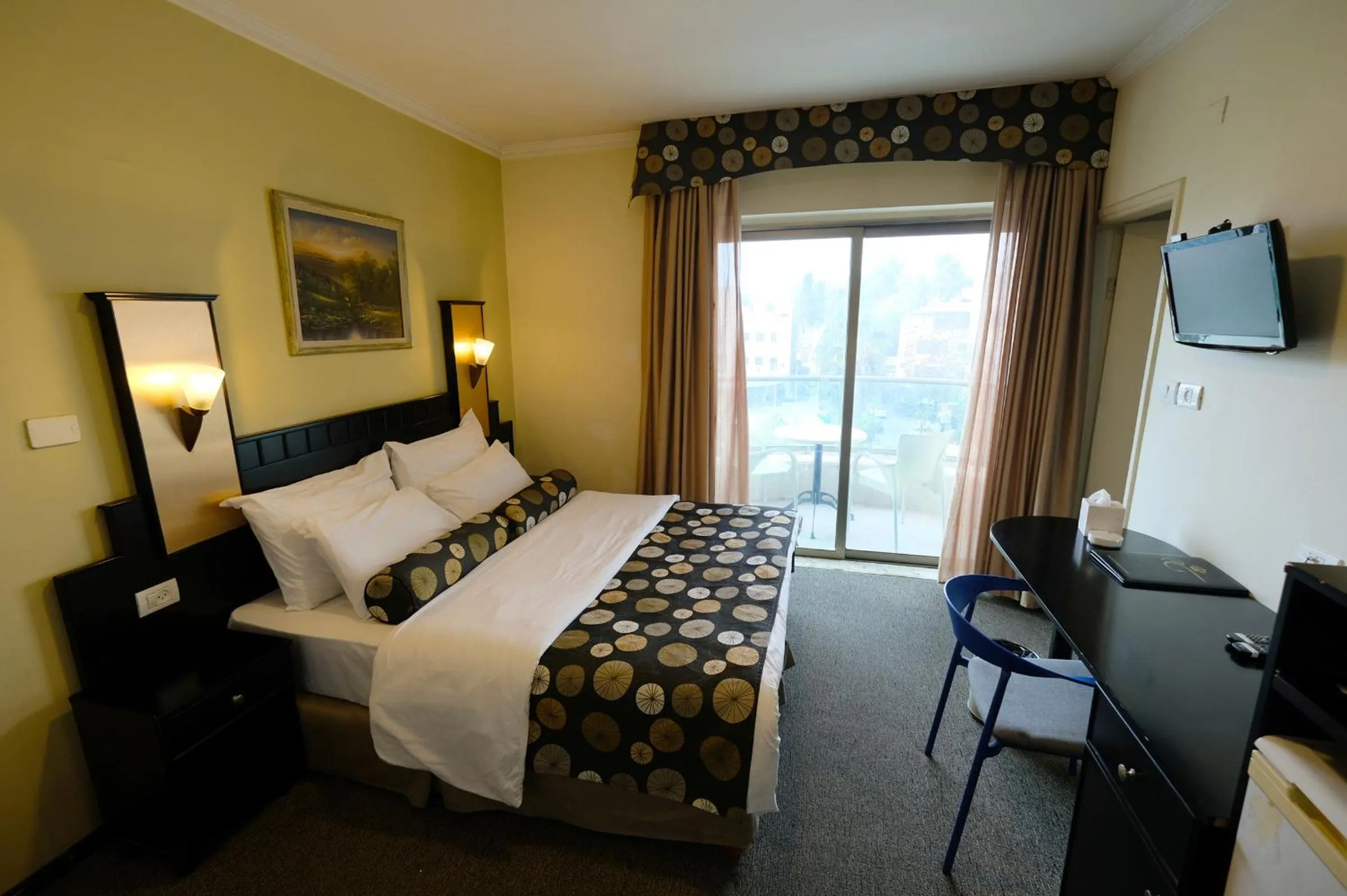 Bed in Royal Court Hotel