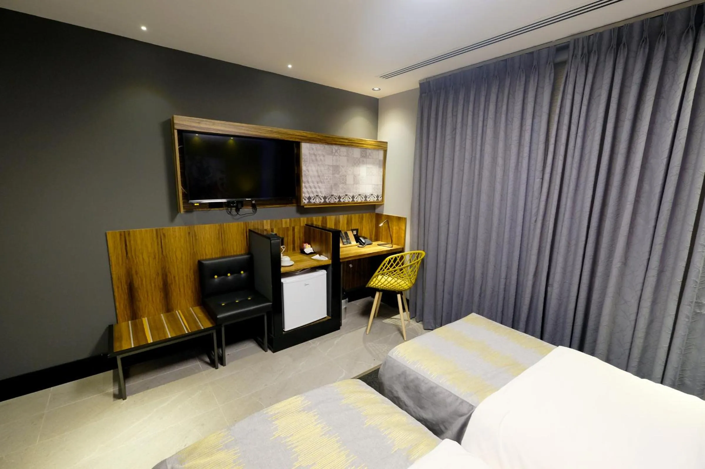 Bed in Royal Court Hotel