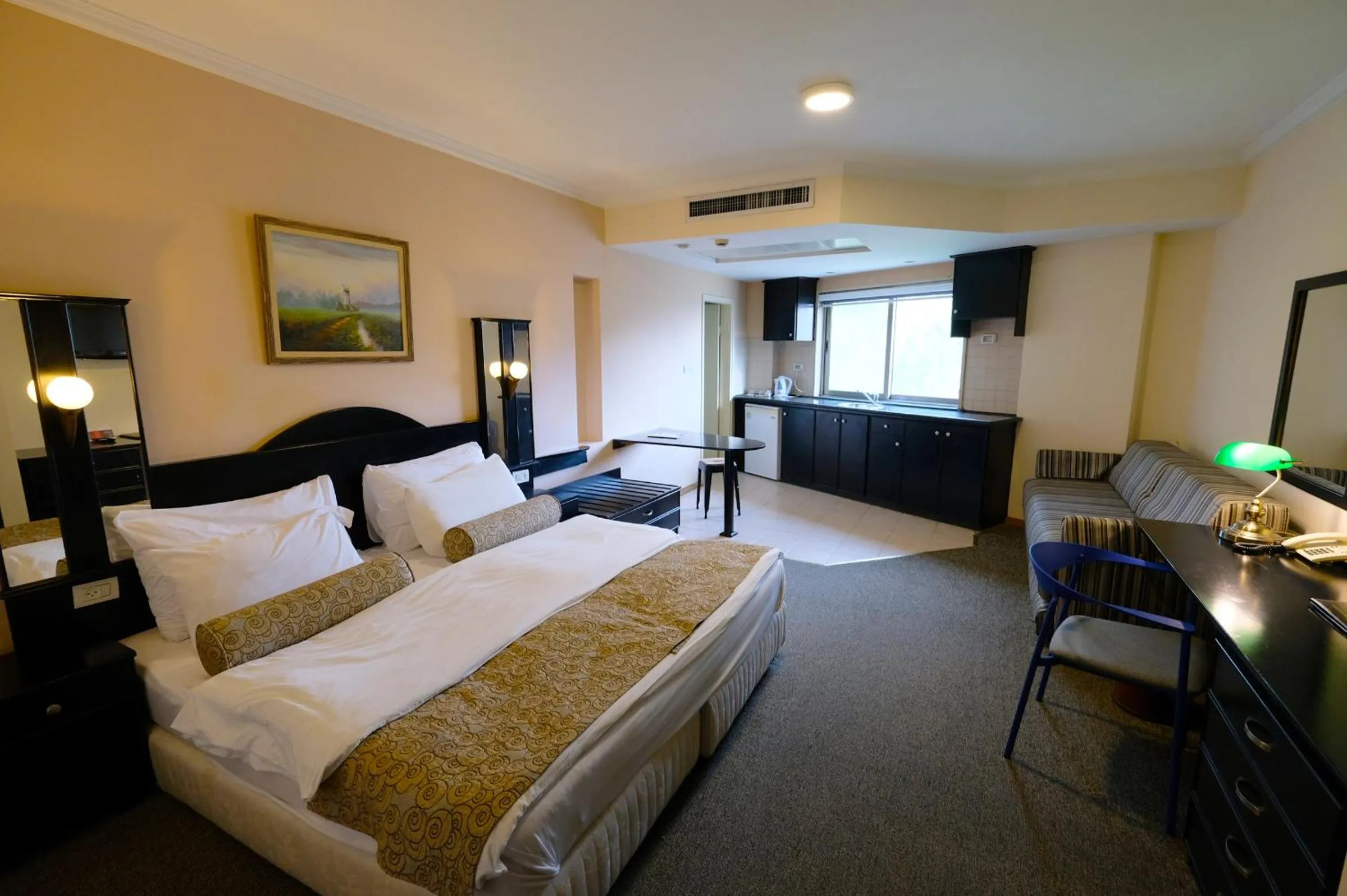 Bed in Royal Court Hotel