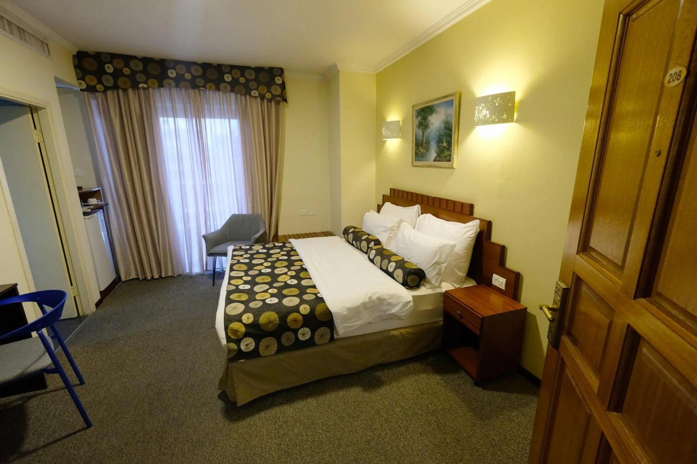 Bed in Royal Court Hotel