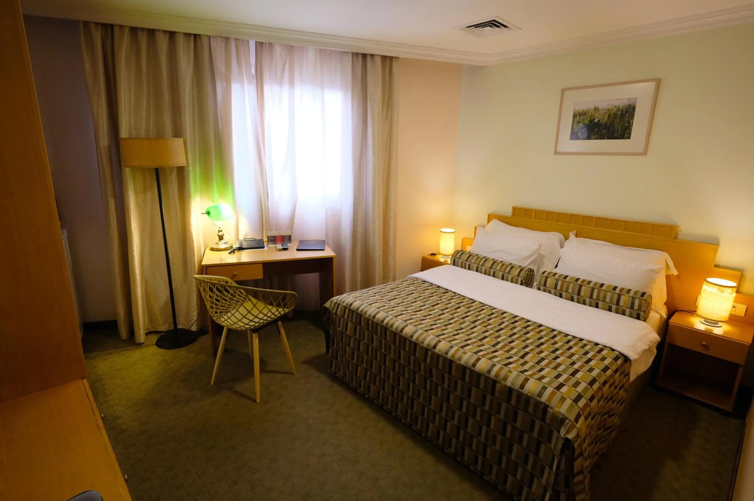 Bed in Royal Court Hotel