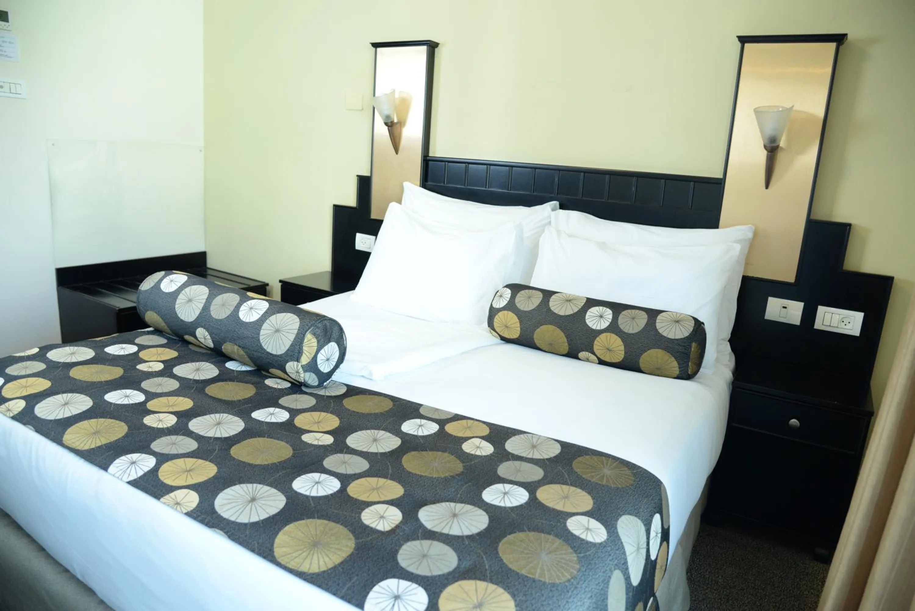 Bed in Royal Court Hotel