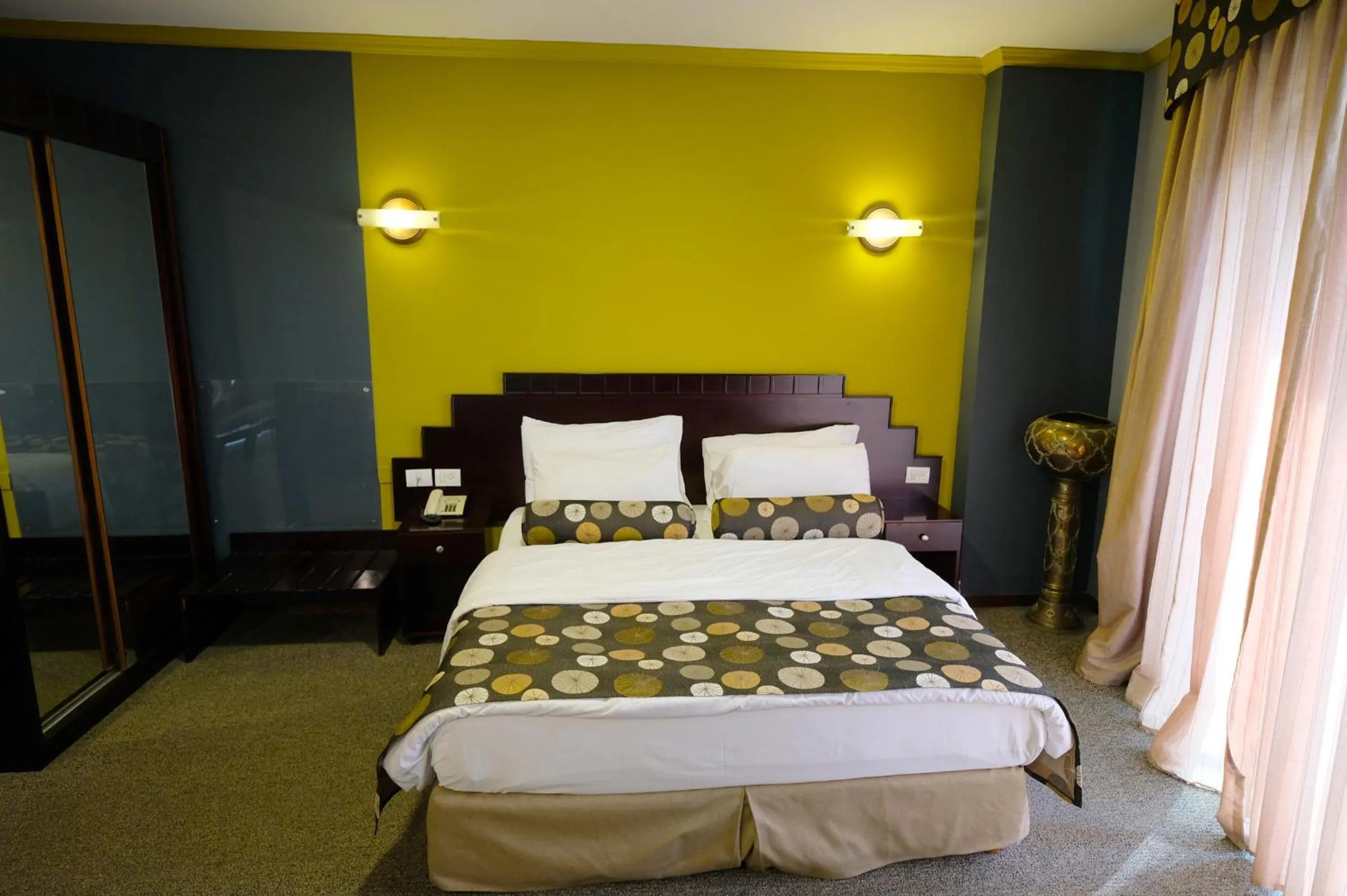 Bed in Royal Court Hotel