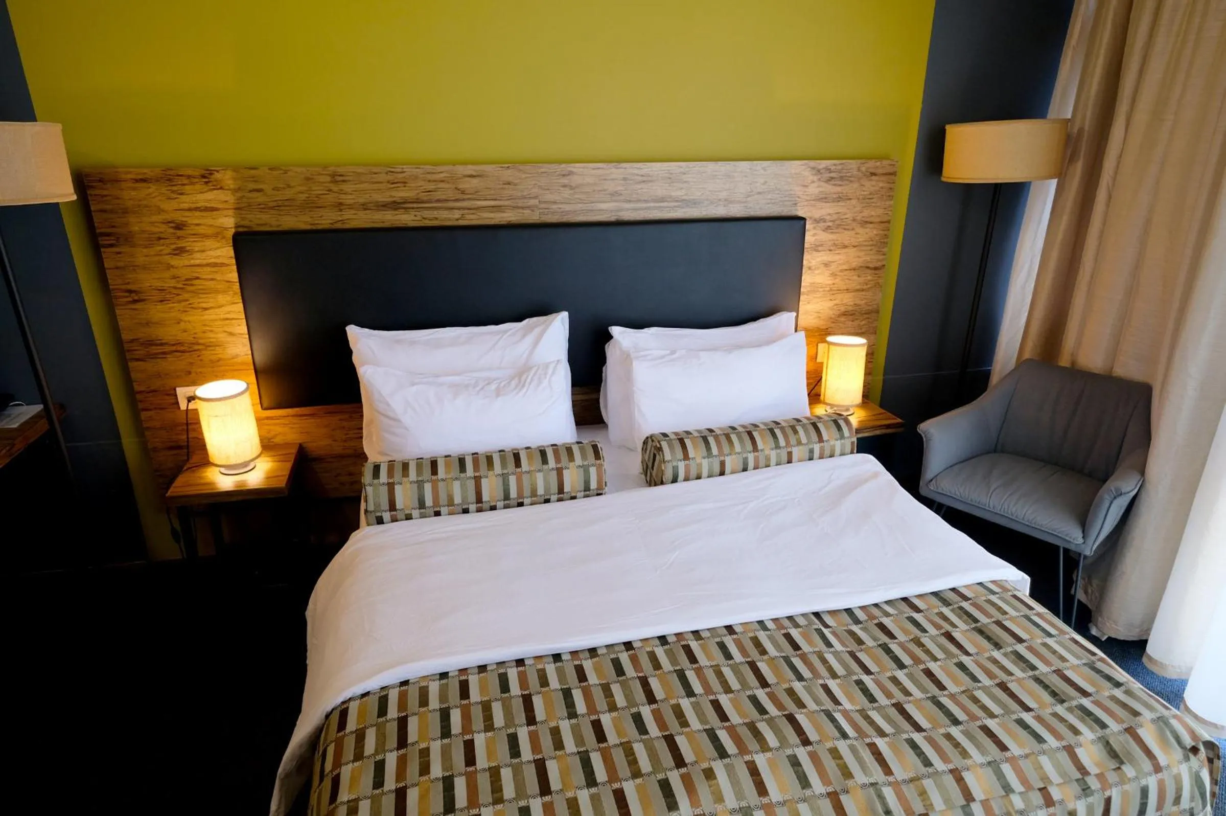 Bed in Royal Court Hotel