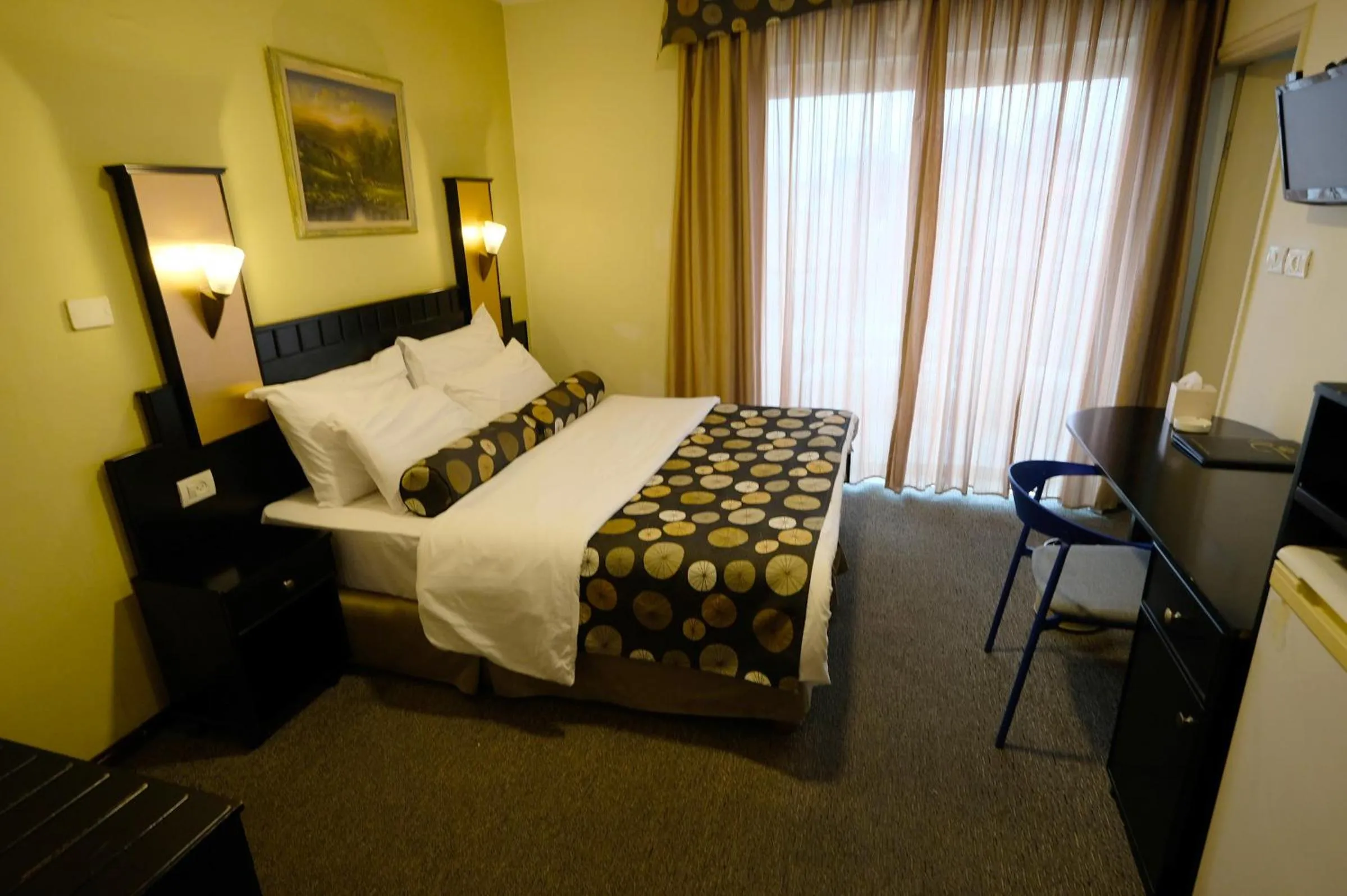 Bed in Royal Court Hotel
