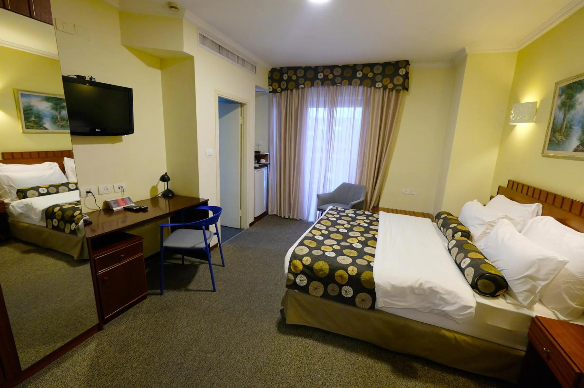 Bed in Royal Court Hotel