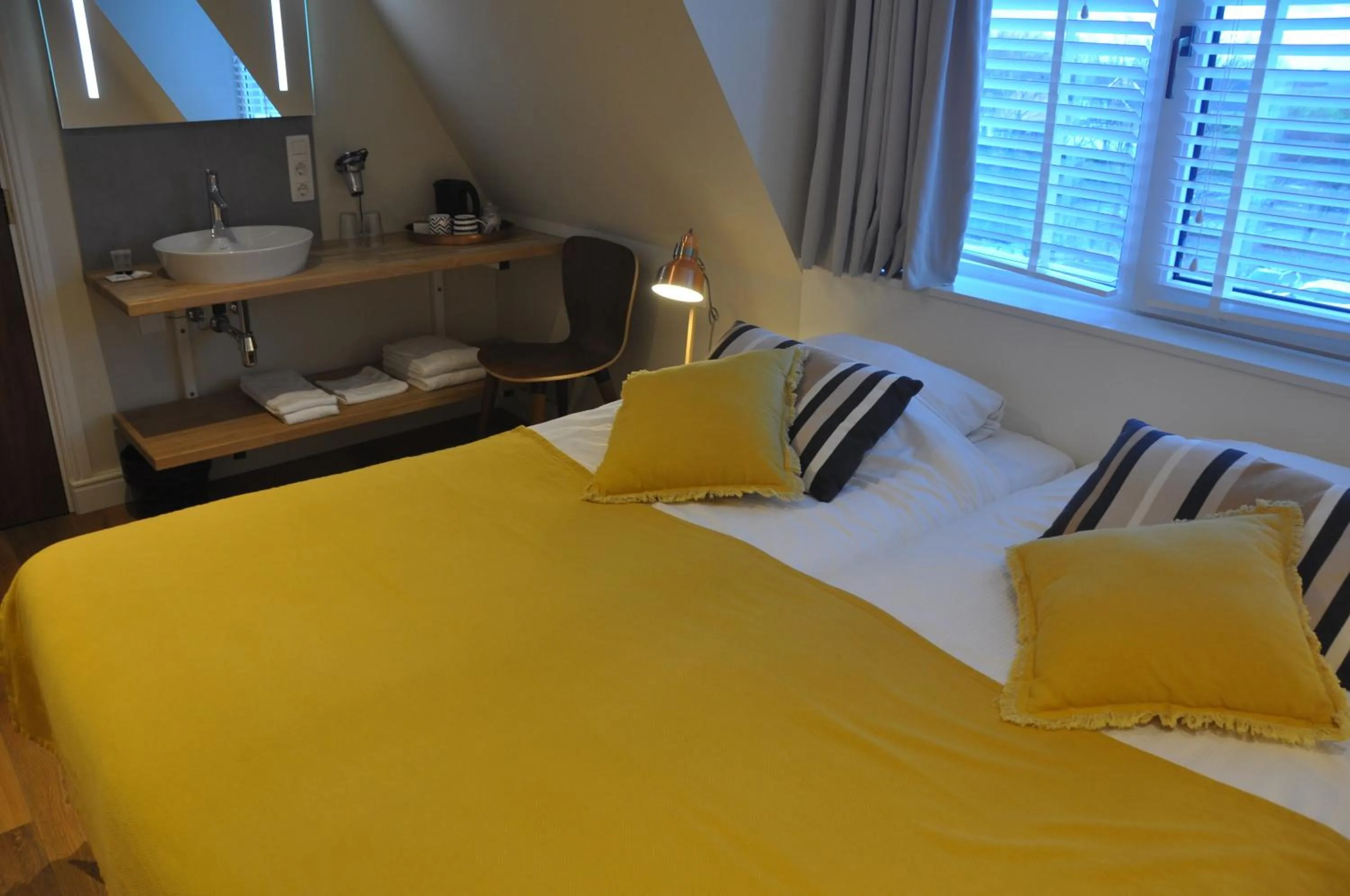Bed in Hotel Sanders de Paauw
