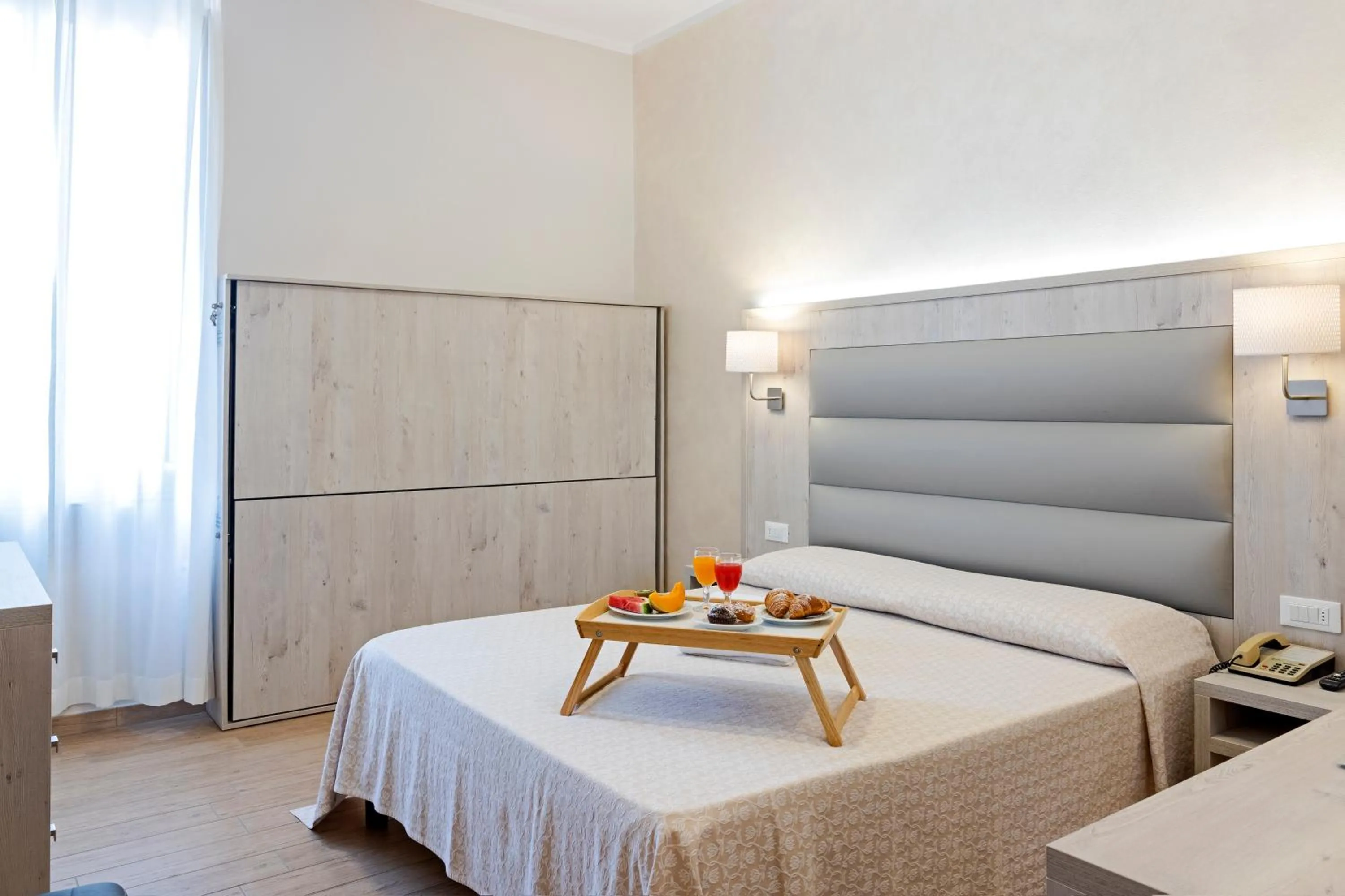 Bed in Hotel Biagi & Residence