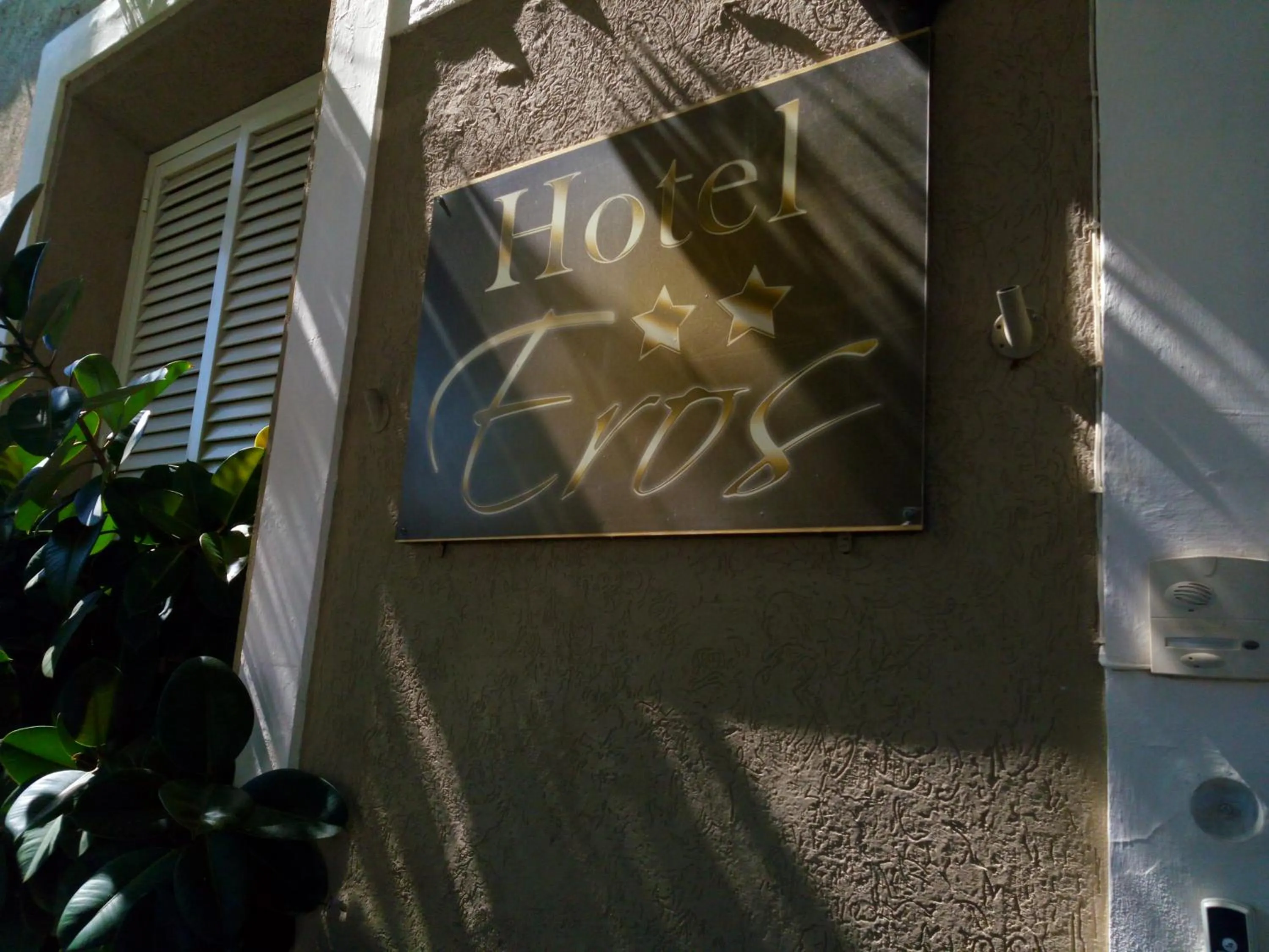 Property logo or sign in Hotel Eros