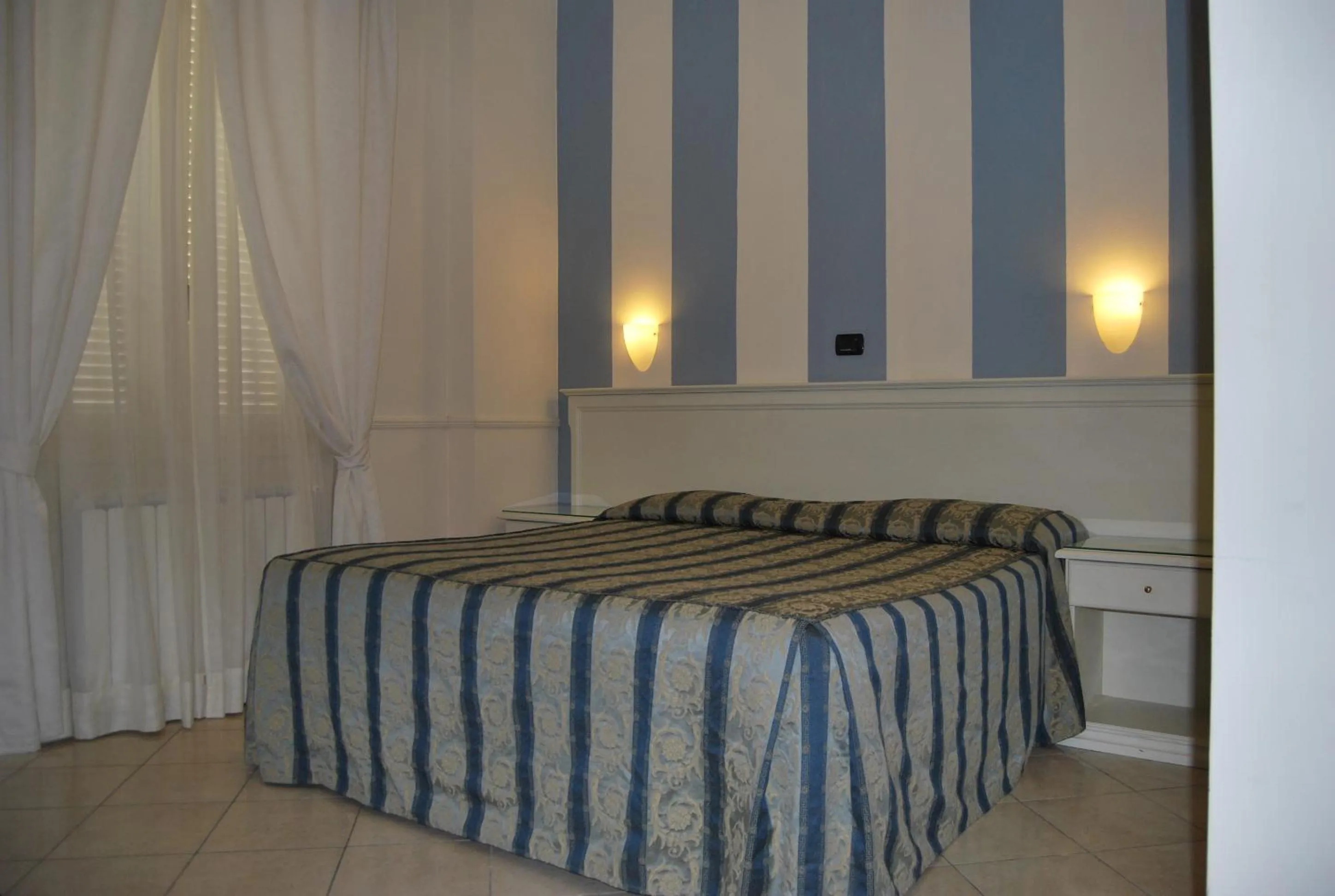 Bed in Hotel Coluccini