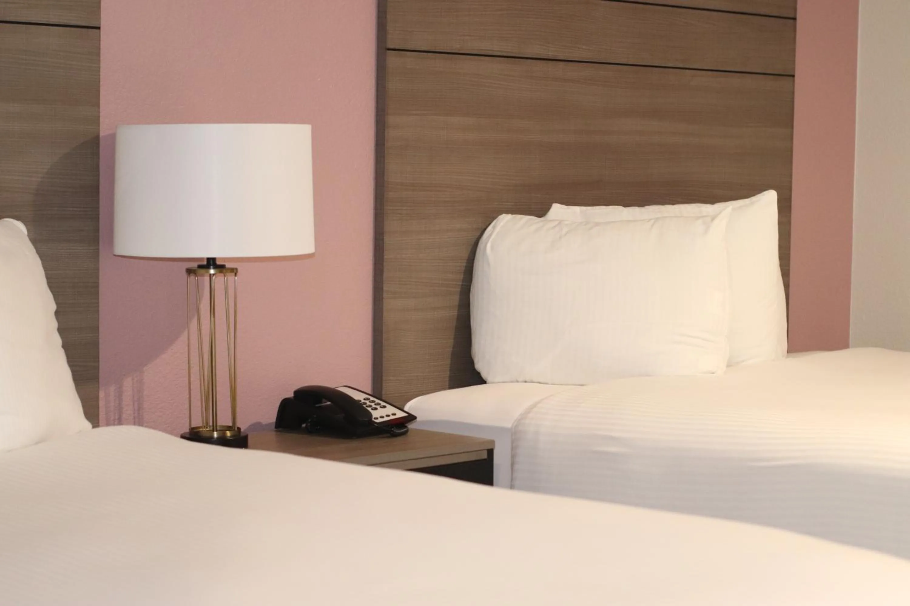 Bed in Arya Inn and Suites