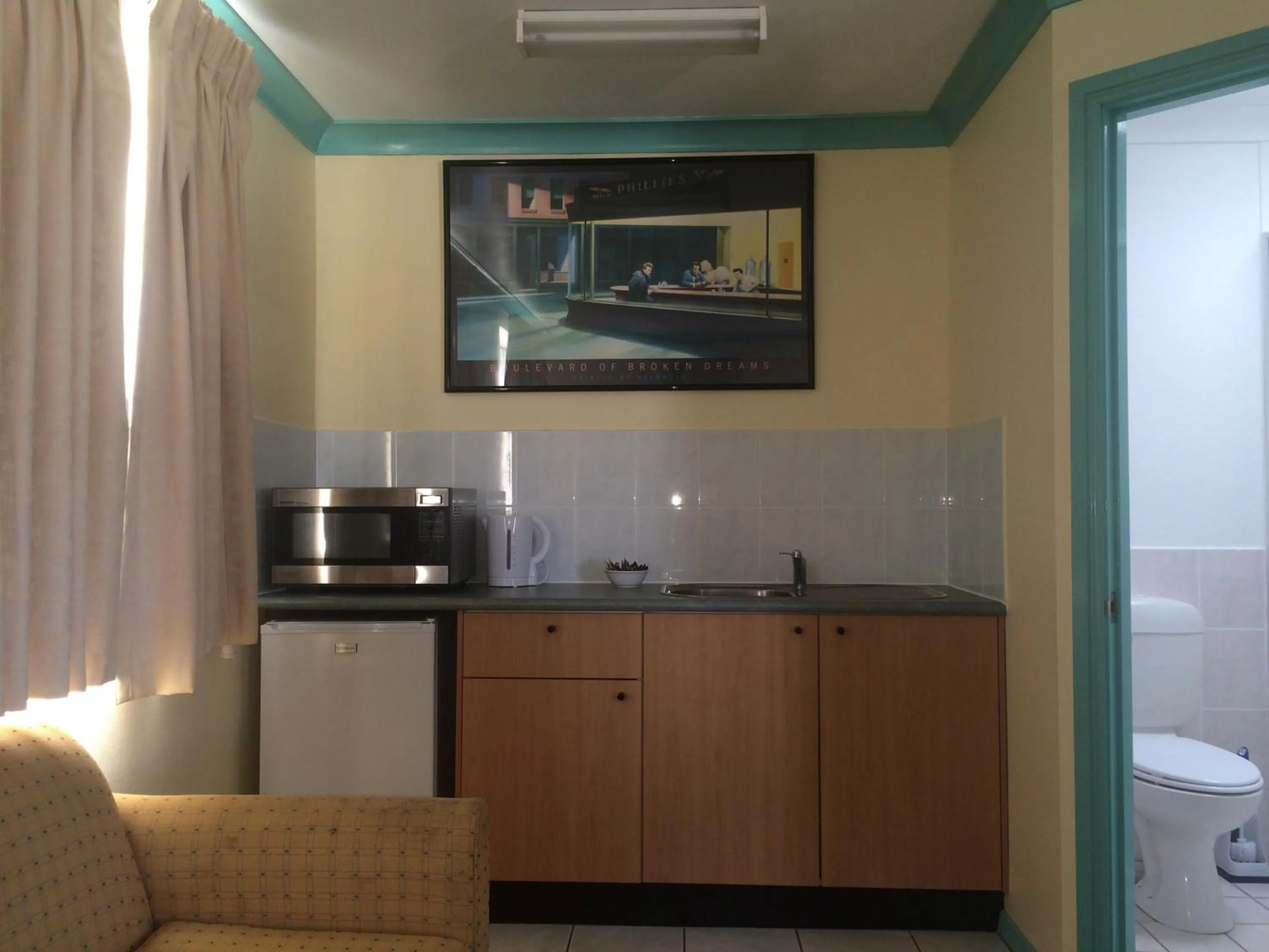 Kitchen or kitchenette in John Oxley Motel