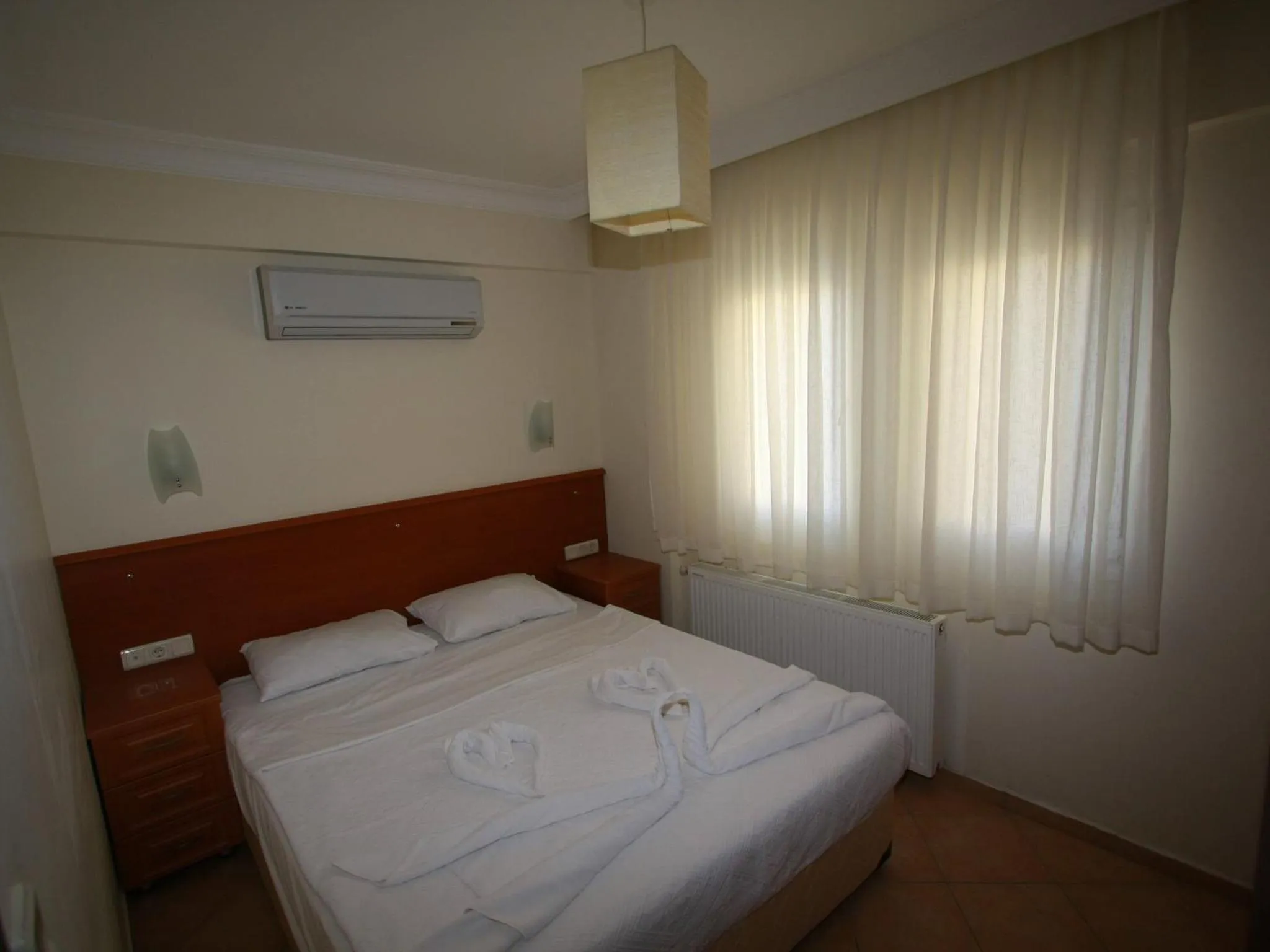 Bed in Sea Breeze Hotel and Apartments